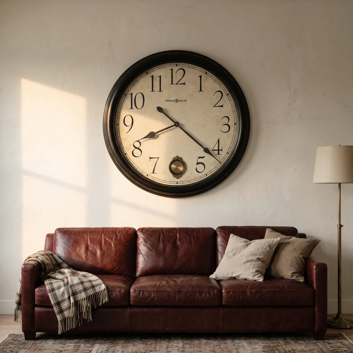 Howard Miller Glenwood Falls Wall Clock, 36-inch, on the wall in a styled room