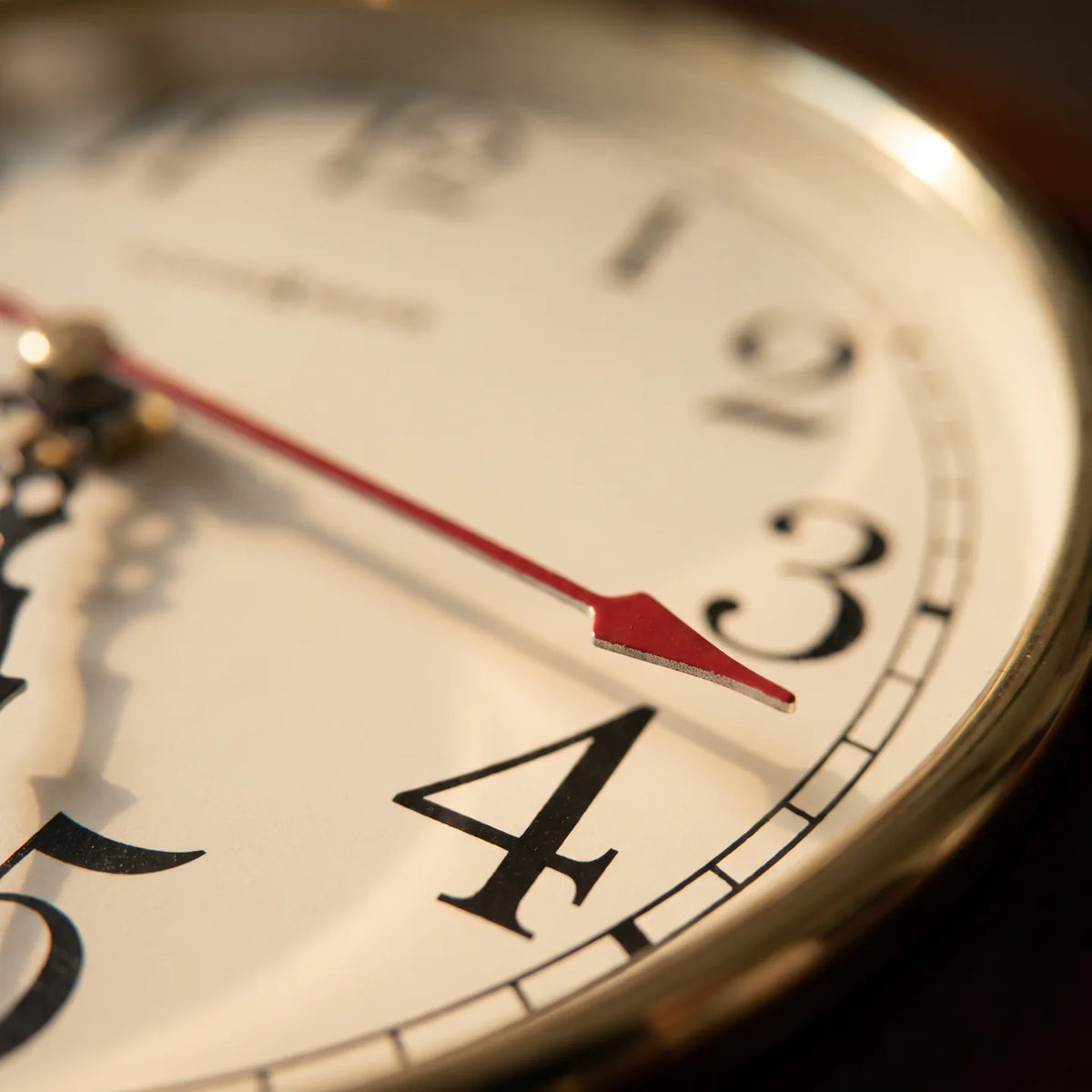 Howard Miller Brentwood Wall Clock, macro close-up of the hands and dial