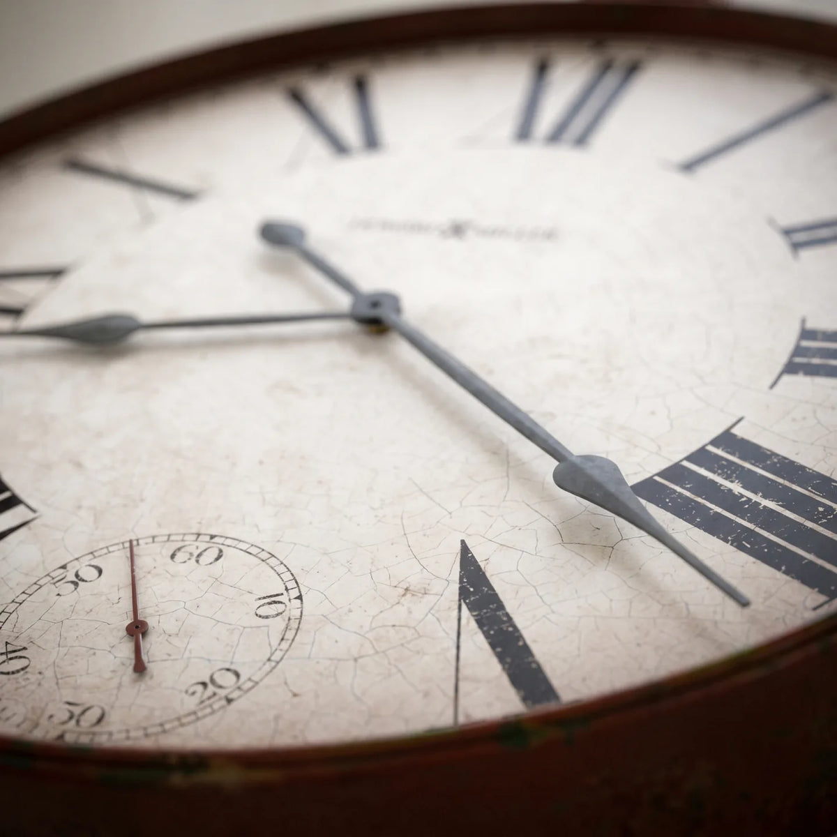 Howard Miller Gallery Pocket Watch II Wall Clock, macro close-up of the hands and dial