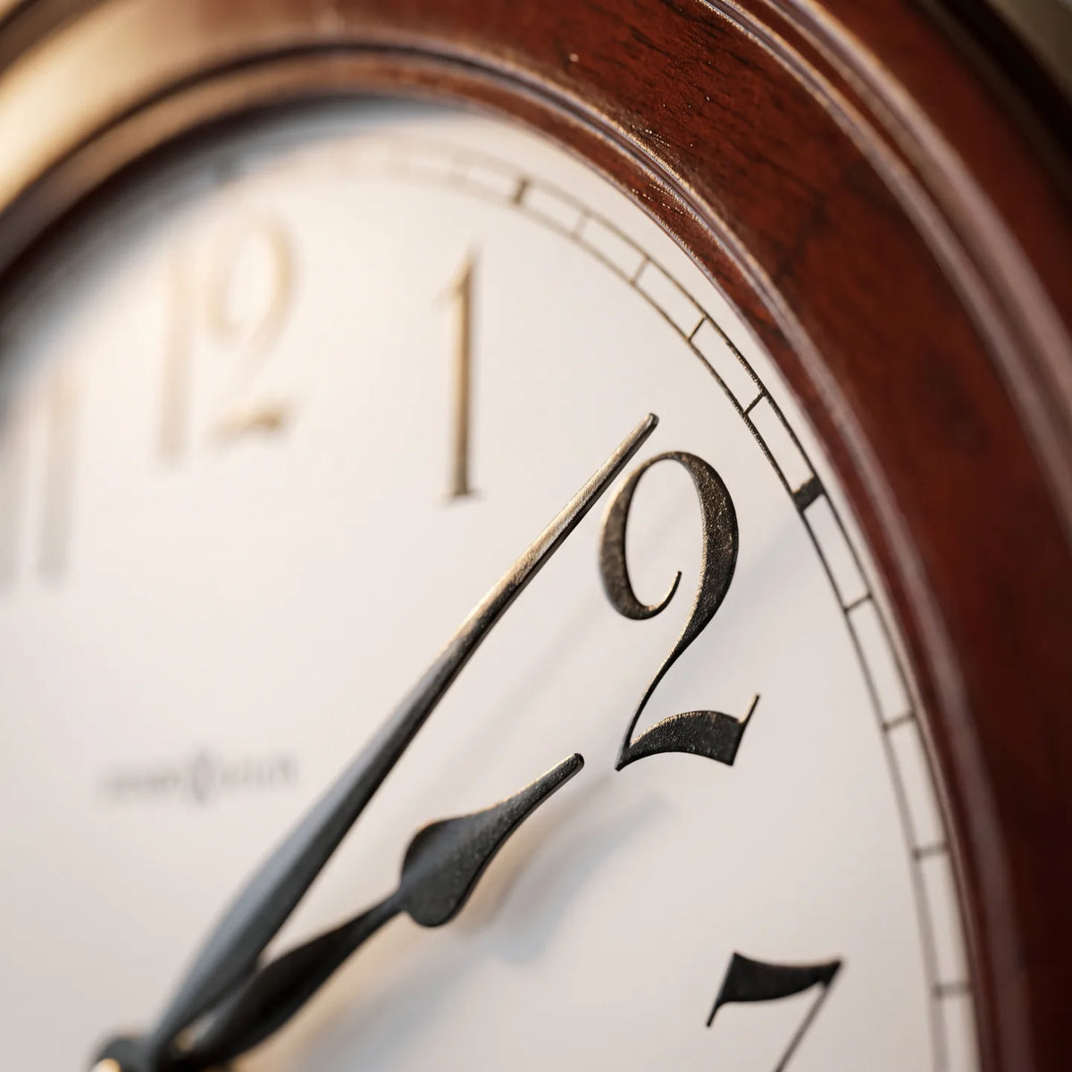 Howard Miller Griffith Wall Clock, macro close-up of the hands and dial