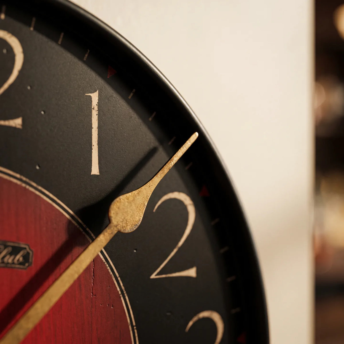 Howard Miller Harmon Wall Clock, macro close-up of the hands and dial