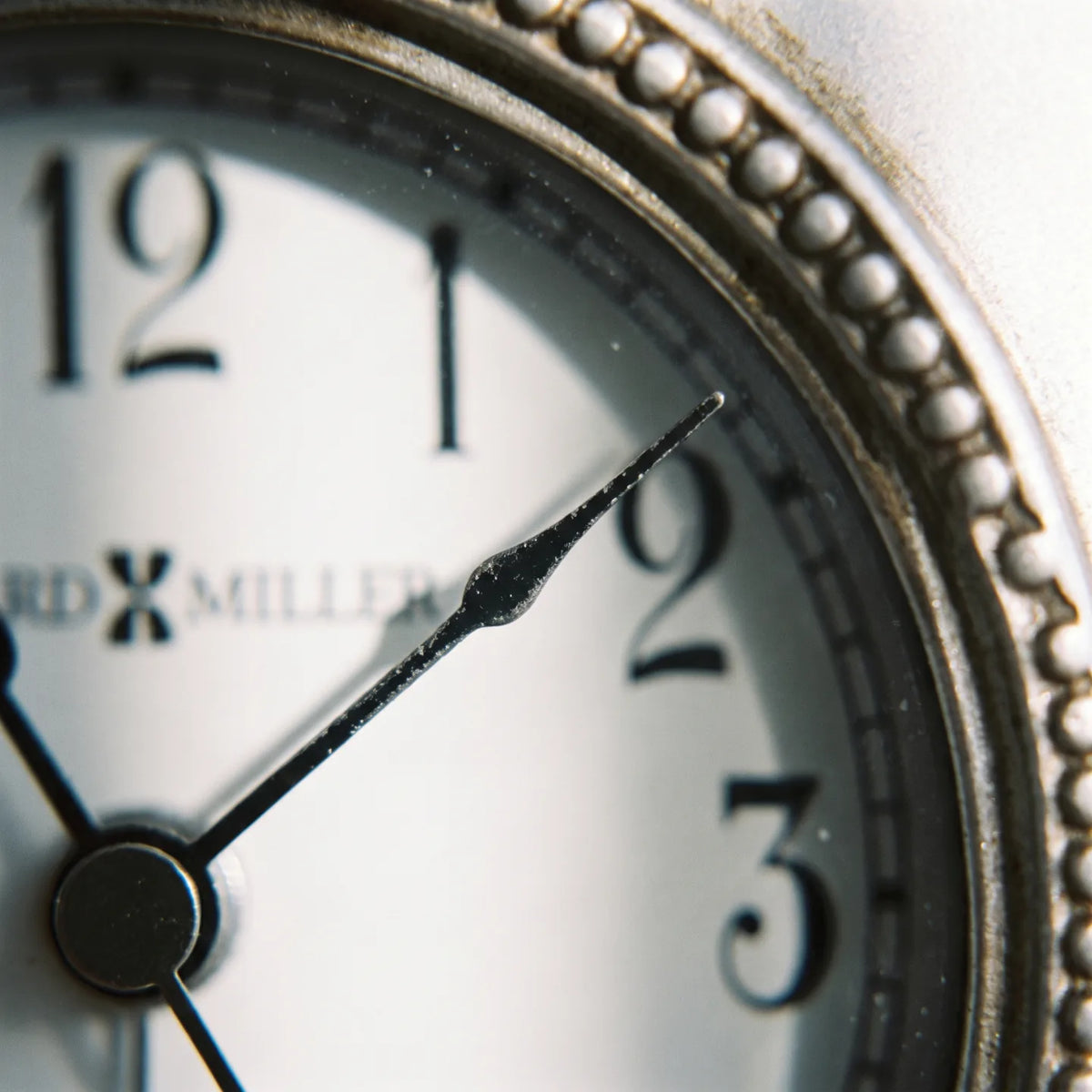 Howard Miller Kegan Tabletop Clock, macro close-up of the hands and dial