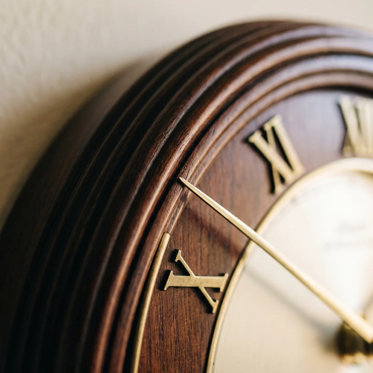 Howard Miller Malia Wall Clock, macro close-up of the hands and dial
