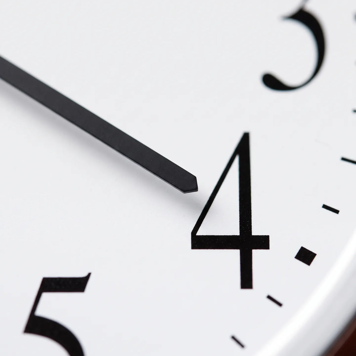 Howard Miller Murrow Wall Clock, macro close-up of the hands and dial