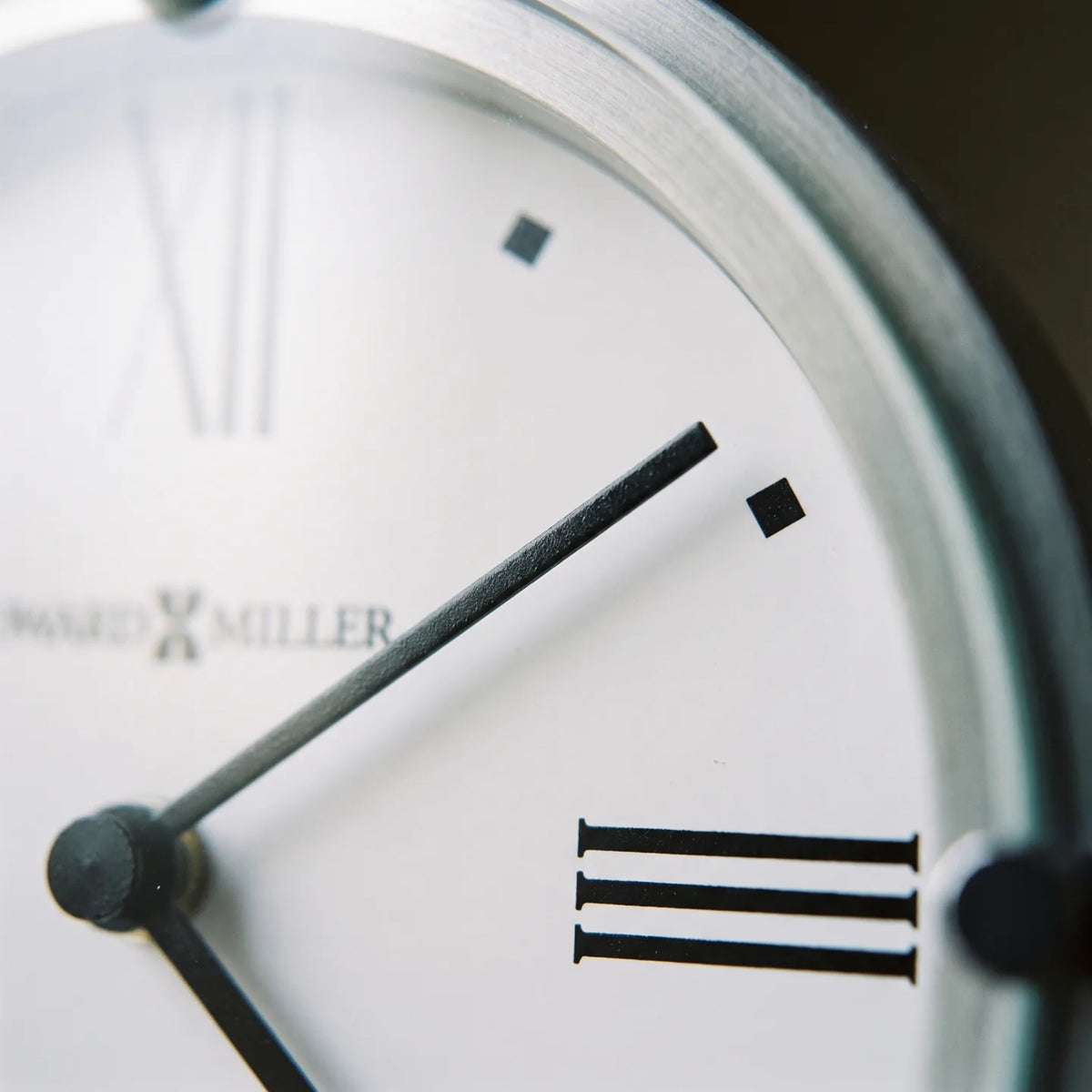 Howard Miller Simon II Tabletop Clock, macro close-up of the hands and dial