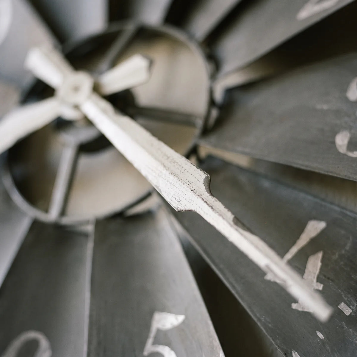Howard Miller Windmill Wall Clock, macro close-up of the hands and dial