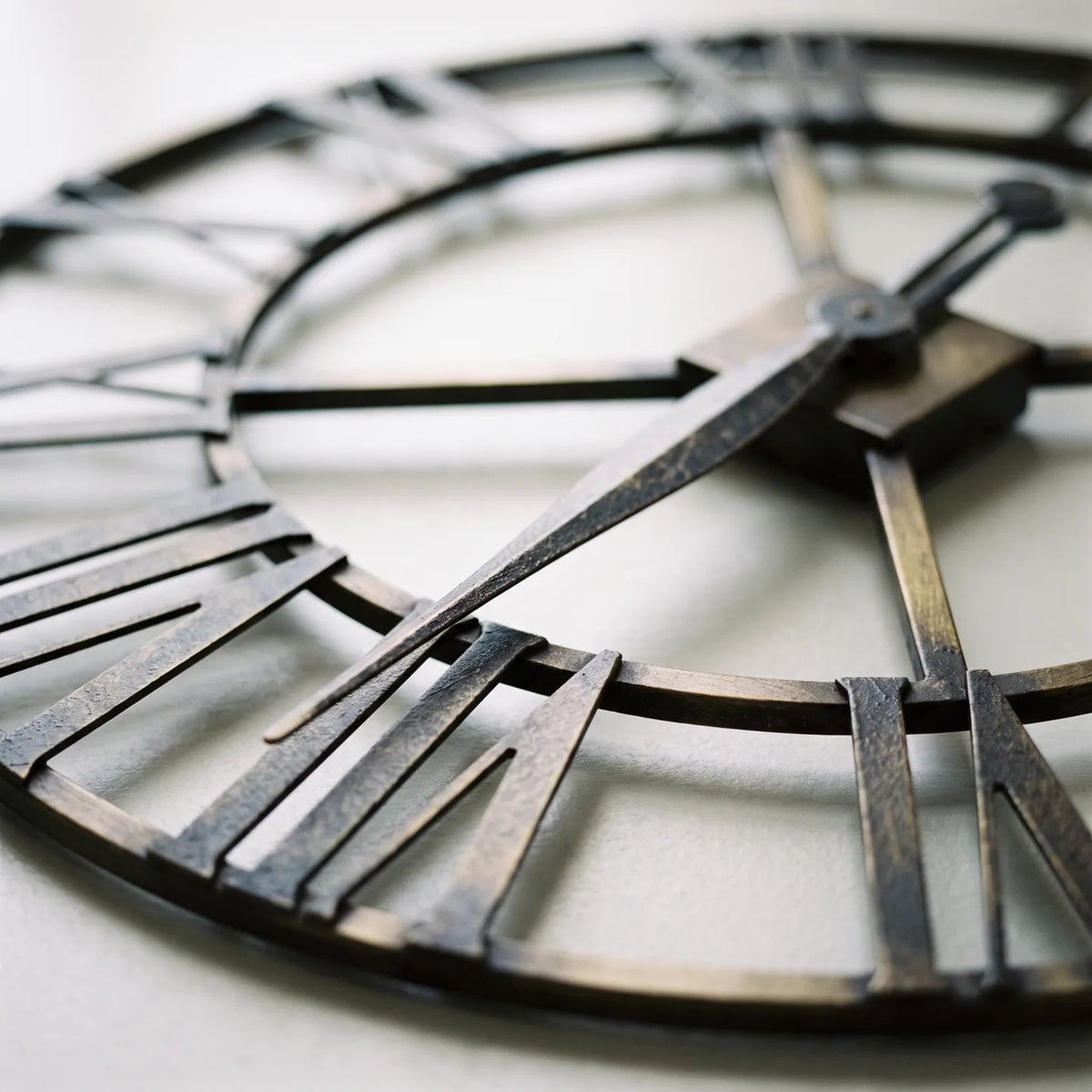 Howard Miller Wingate Wall Clock, macro close-up of the hands and dial
