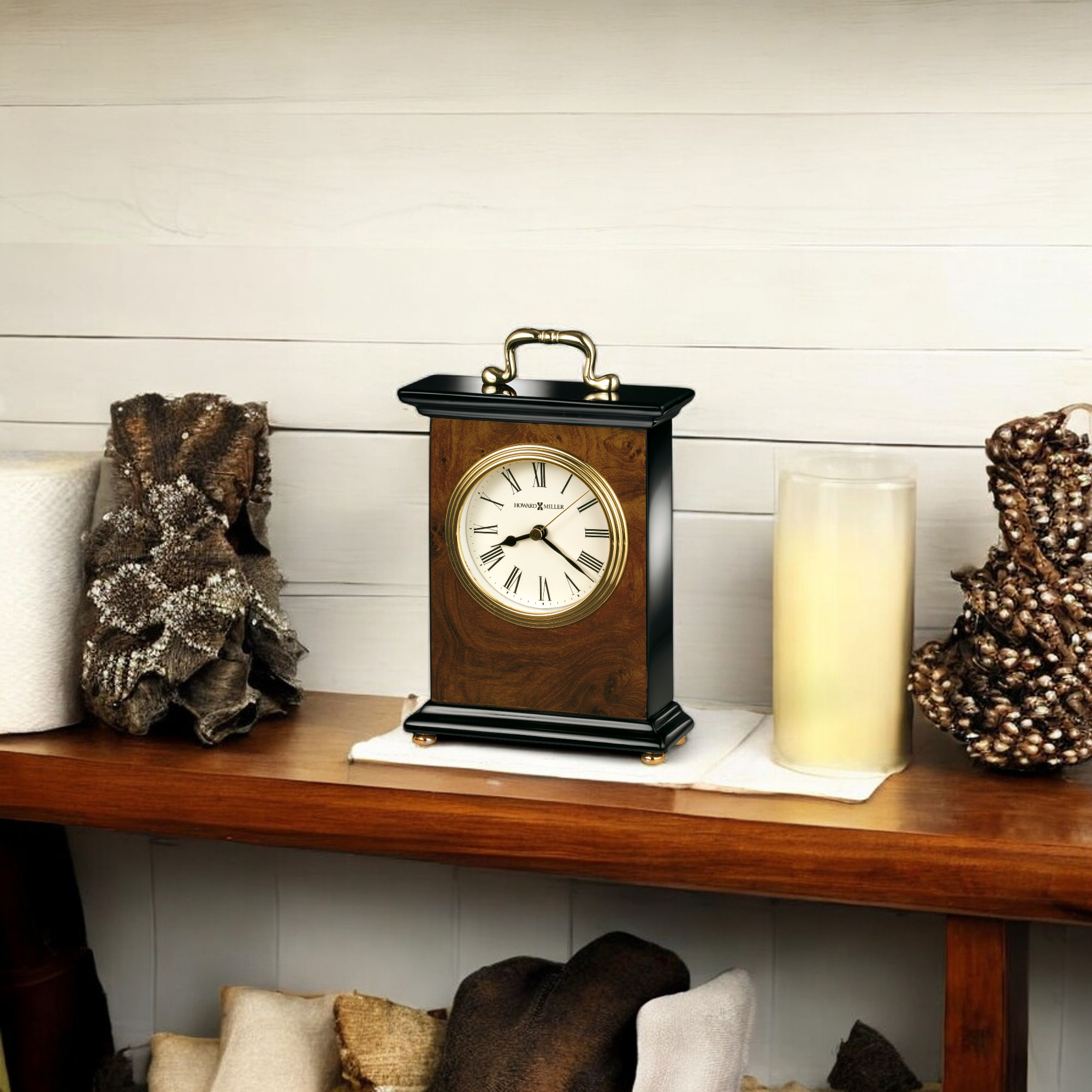 A vintage clock on a wooden shelf with decorative items.