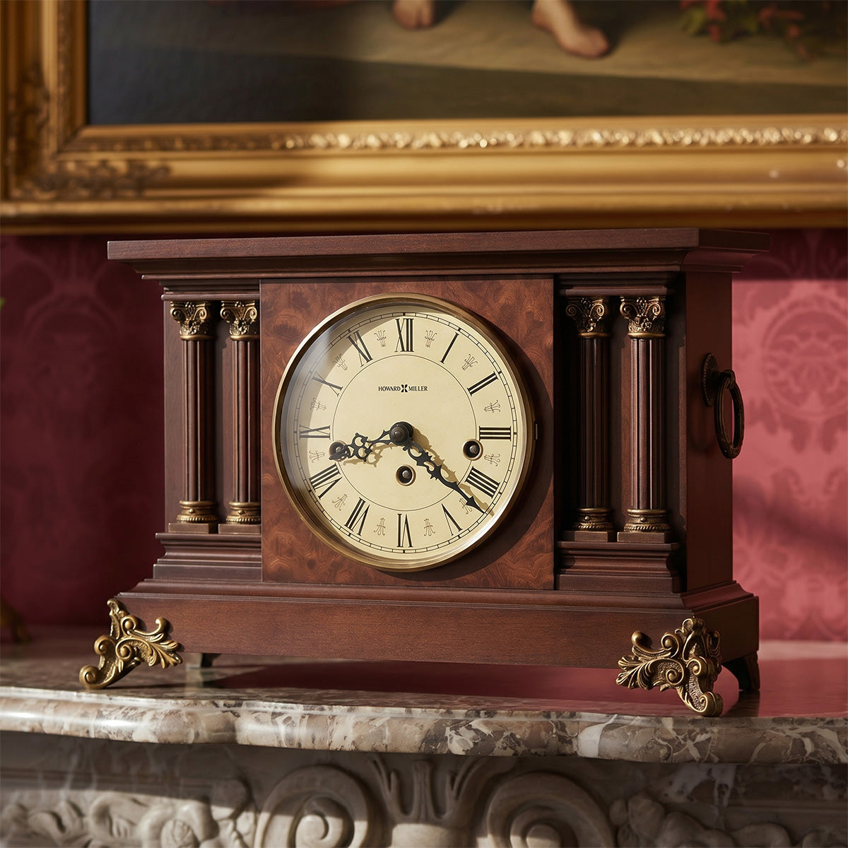 Vintage wooden clock with gold accents on a marble surface, framed painting in the background