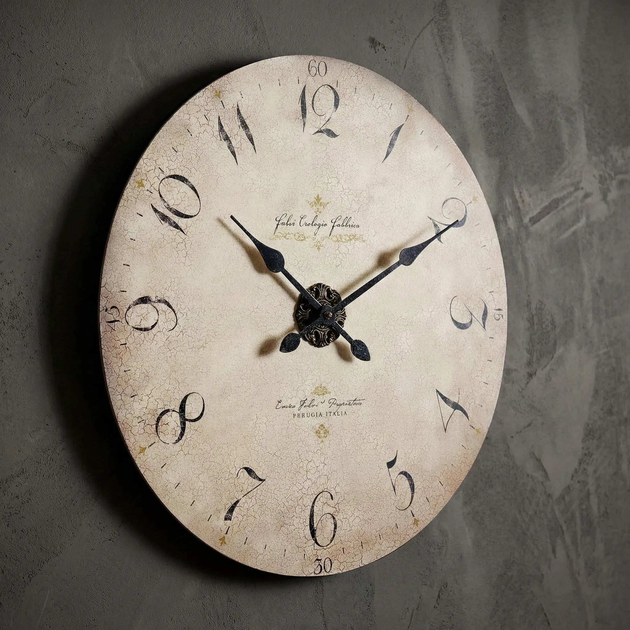 Vintage wall clock, antique cream face with black numerals, iron hands, and decorative central design.
