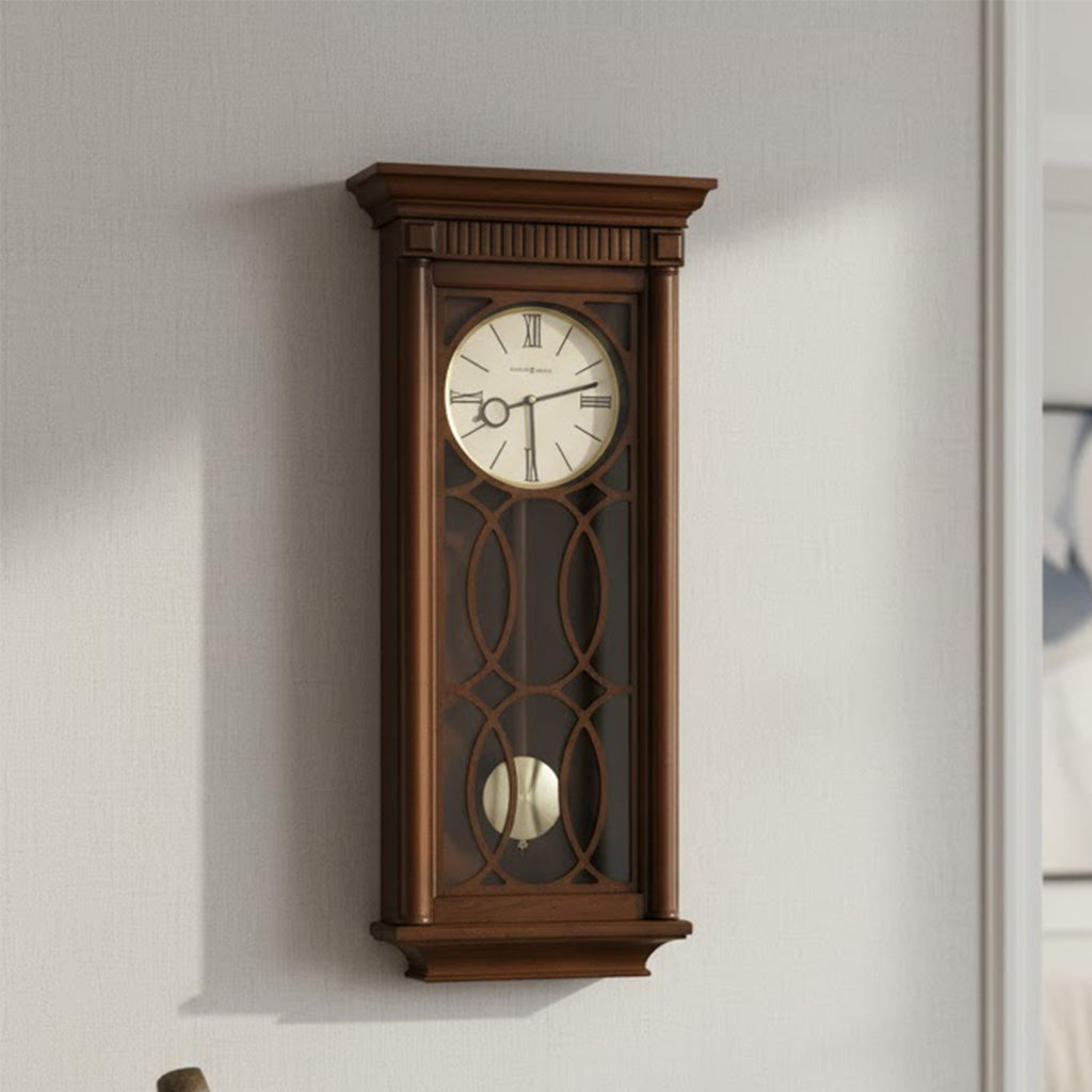Elegant wooden wall clock in rich brown, featuring Roman numerals and decorative glass design.