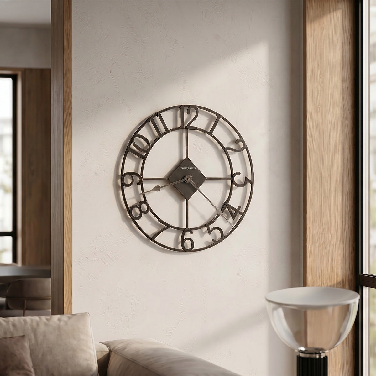 Decorative wall clock on a wall in a room with furniture and decor.