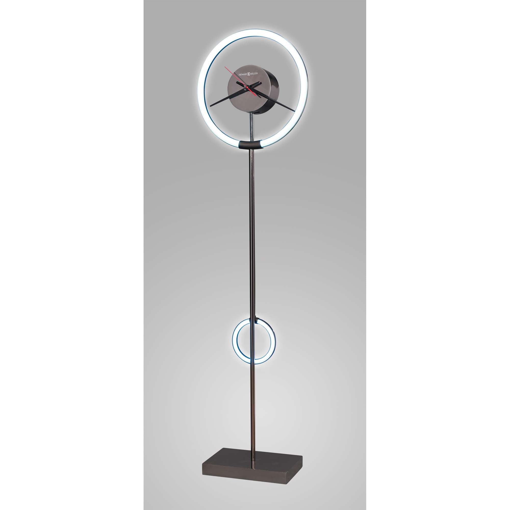 Modern floor clock with a circular design and LED accents.