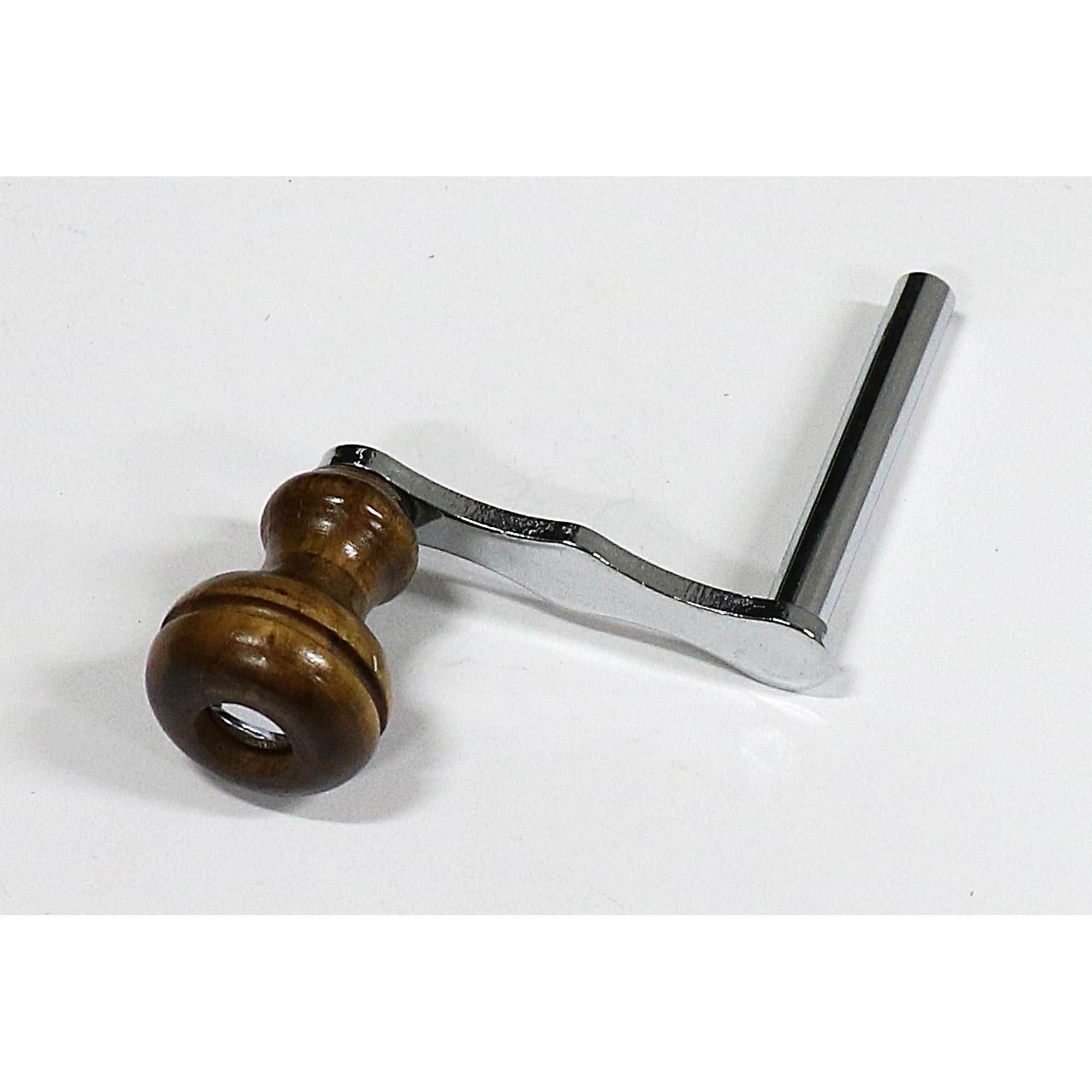 A wooden handle attached to a metal crank