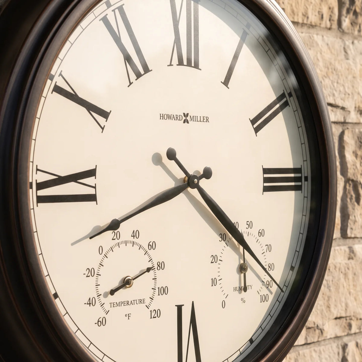 Howard Miller Aspen Outdoor Wall Clock, close-up of the dial and finish detail
