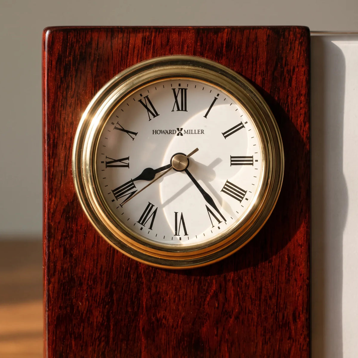 Howard Miller Portrait Caddy Tabletop Clock, close-up of the dial and finish detail