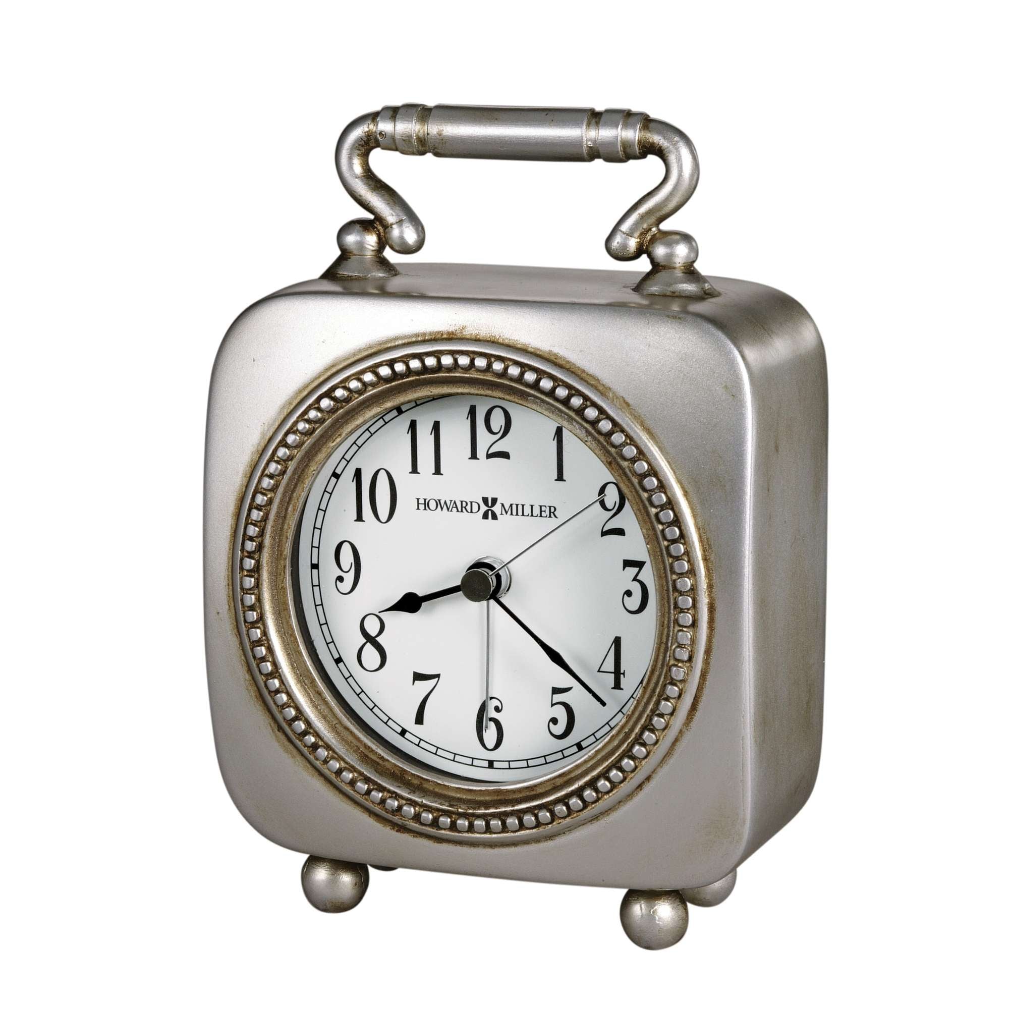 A vintage-style silver alarm clock with a round face and decorative border.