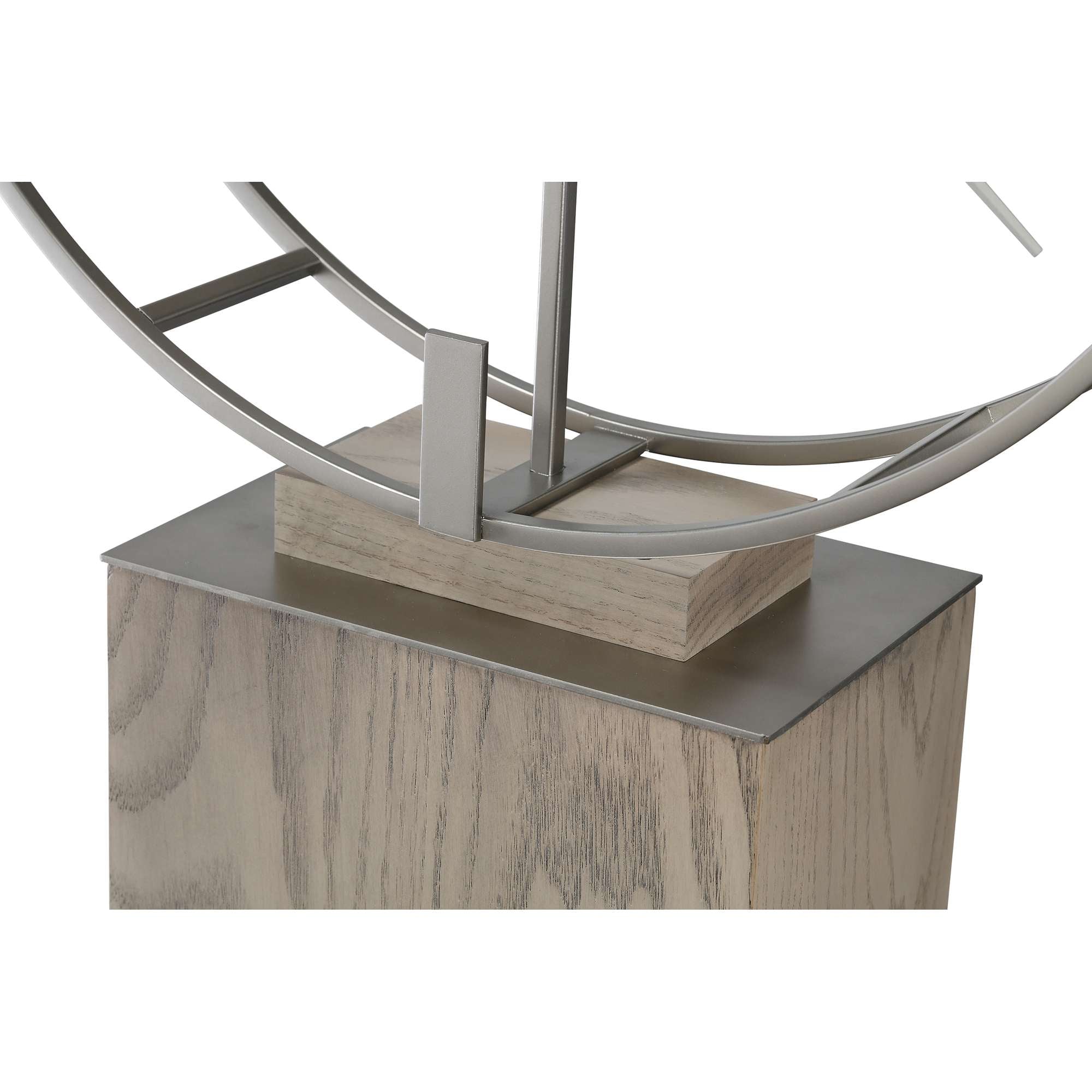 Close-up of a decorative metallic sculpture on a wooden base