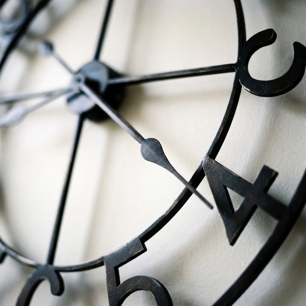 Howard Miller Artwell Wall Clock, macro close-up of the hands and dial