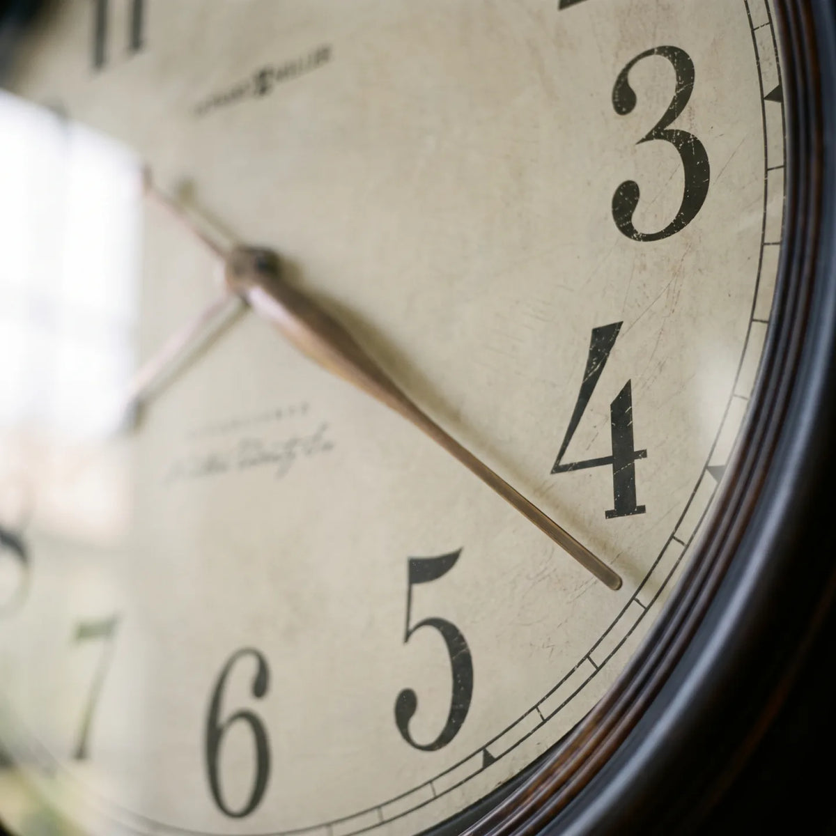 Howard Miller Ashby Wall Clock, macro close-up of the hands and dial