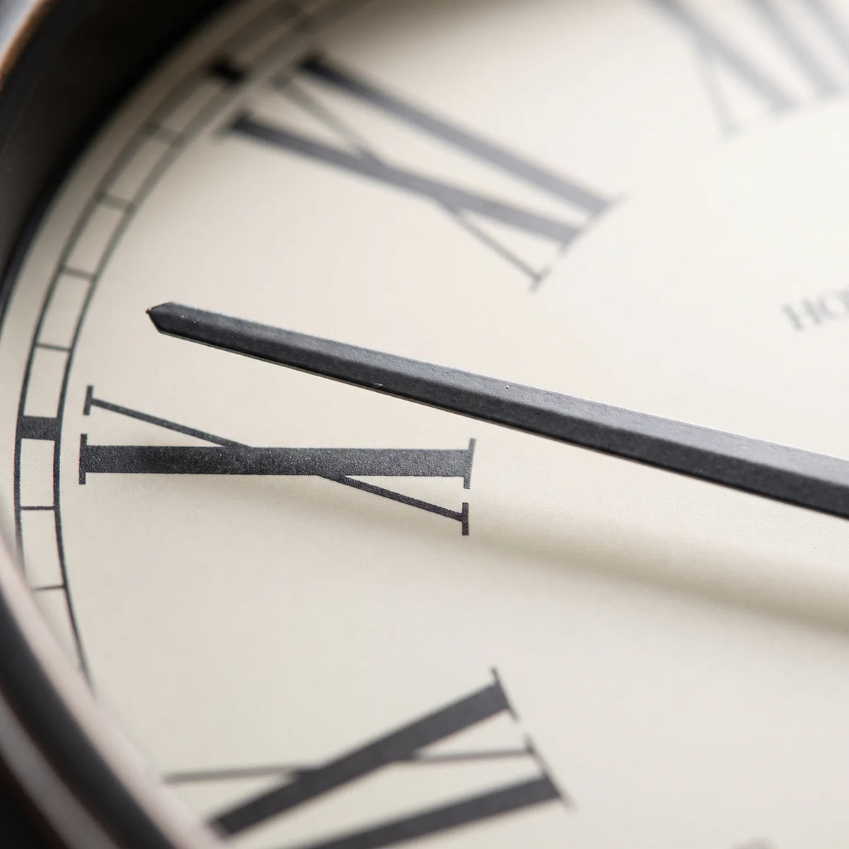 Howard Miller Aspen Outdoor Wall Clock, macro close-up of the hands and dial