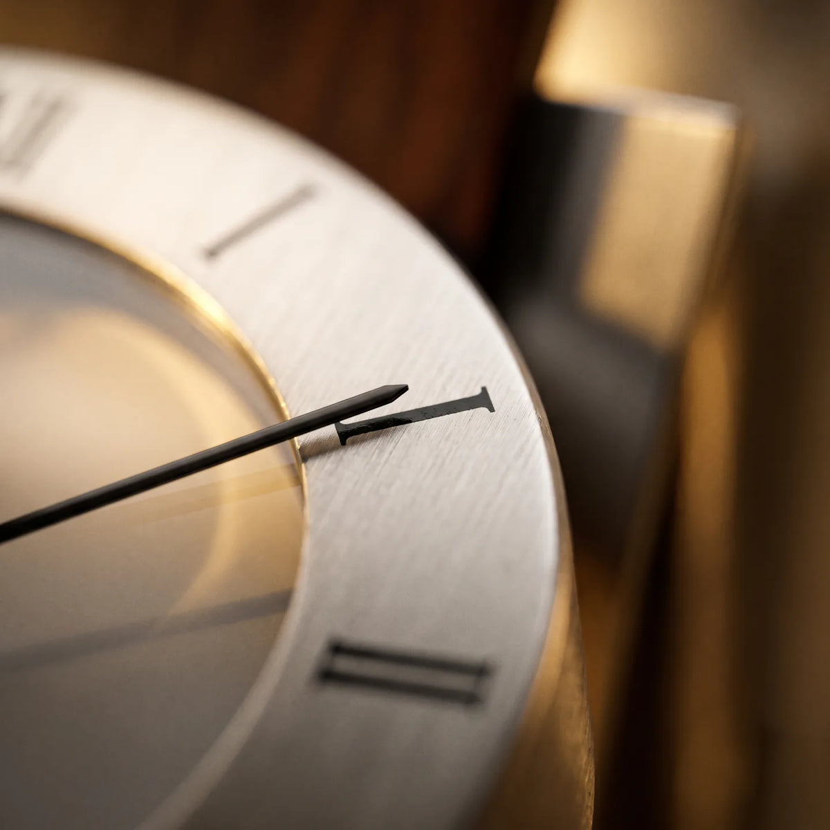 Howard Miller Bergen Wall Clock, macro close-up of the hands and dial