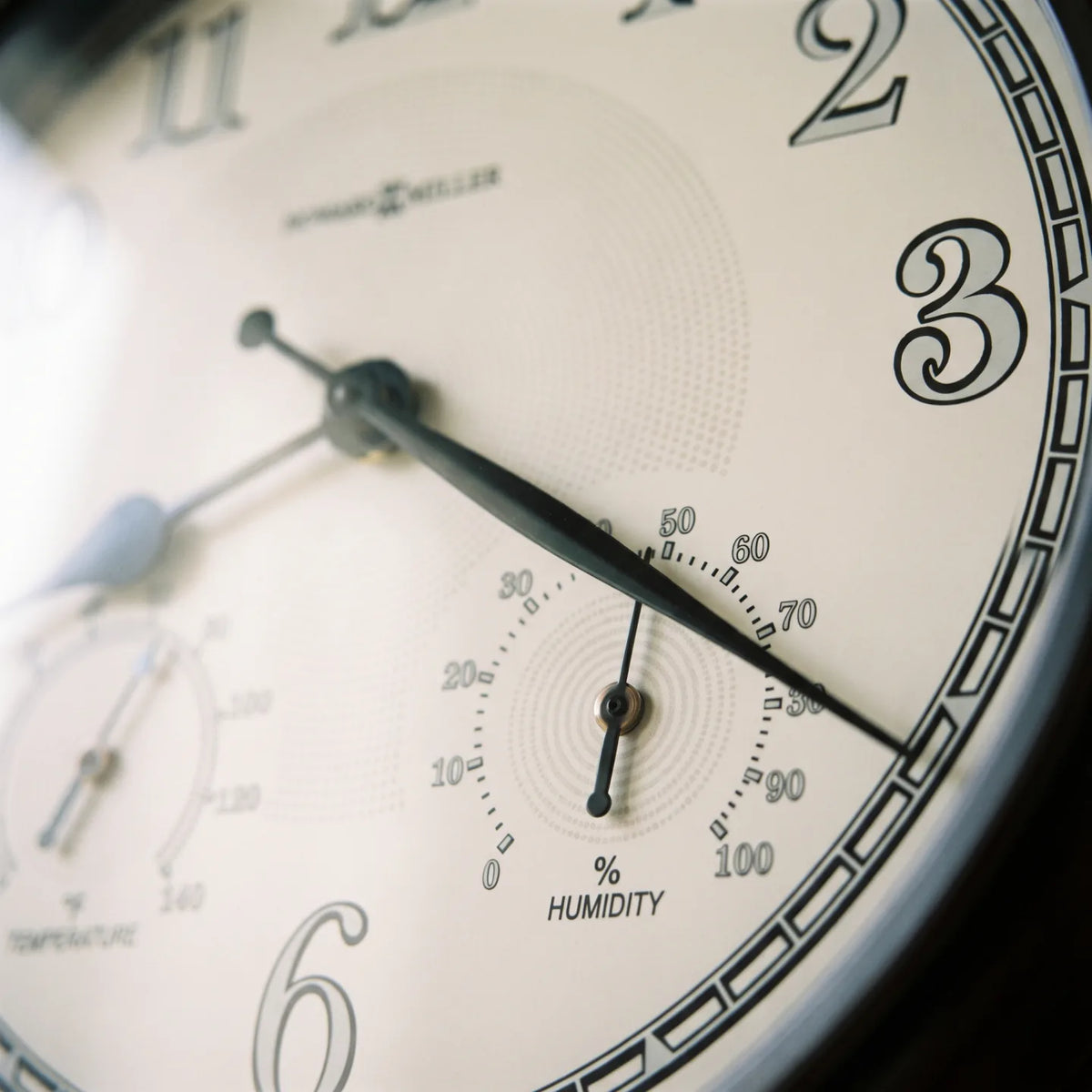 Howard Miller Briar Outdoor Wall Clock, macro close-up of the hands and dial
