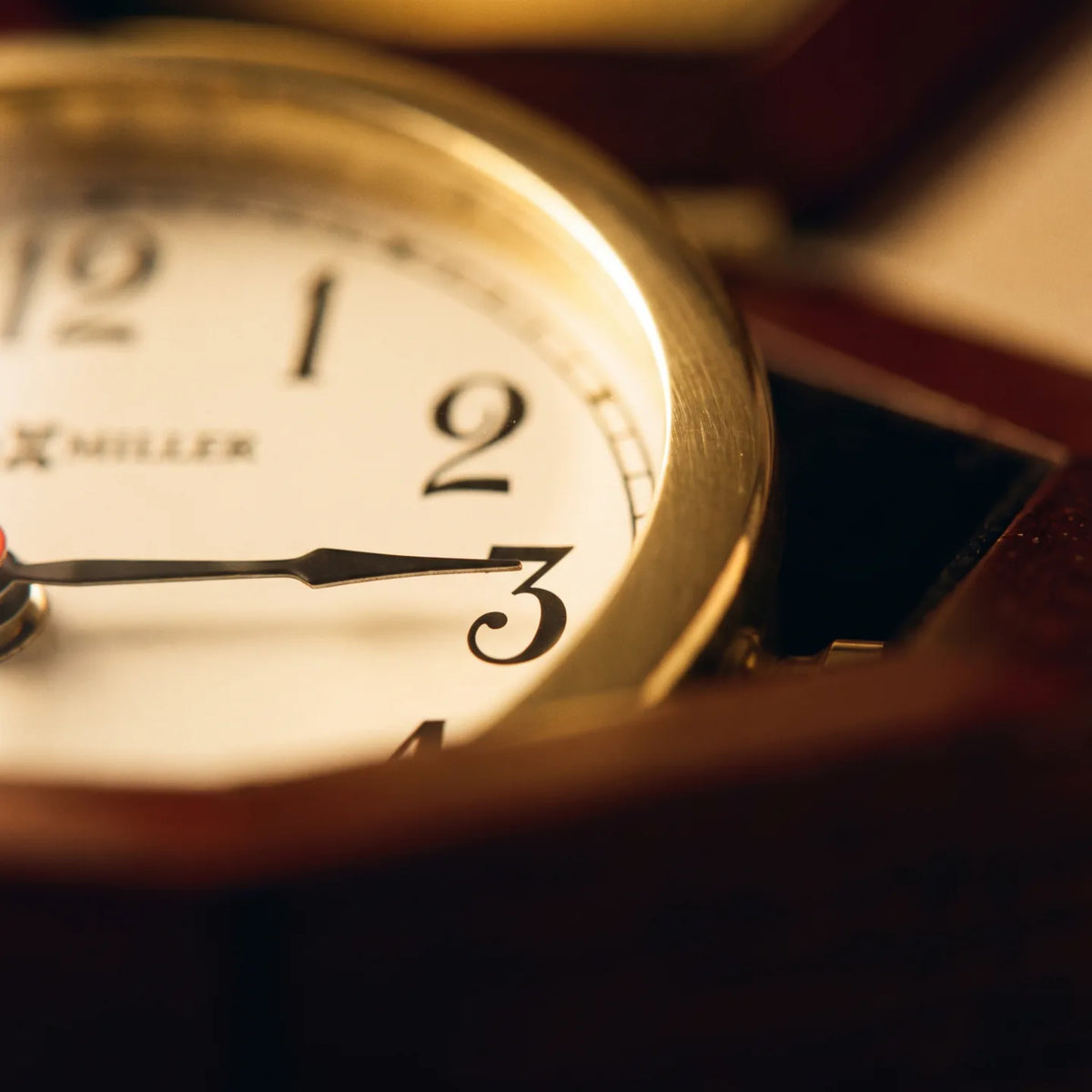 Howard Miller Chronometer Tabletop Clock, macro close-up of the hands and dial
