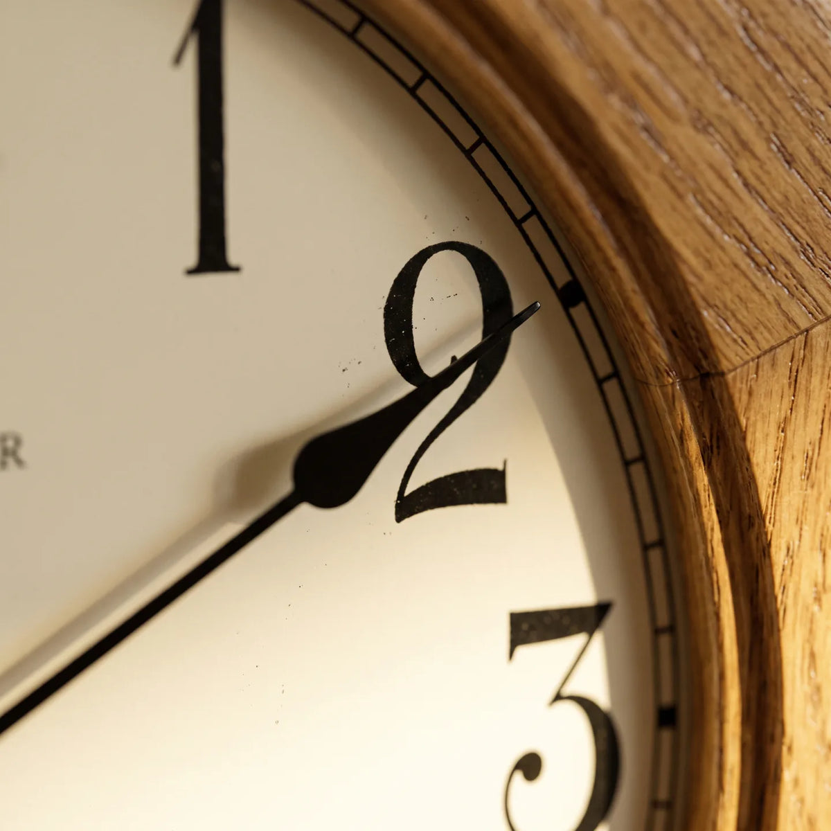 Howard Miller Elliott Wall Clock, macro close-up of the hands and dial