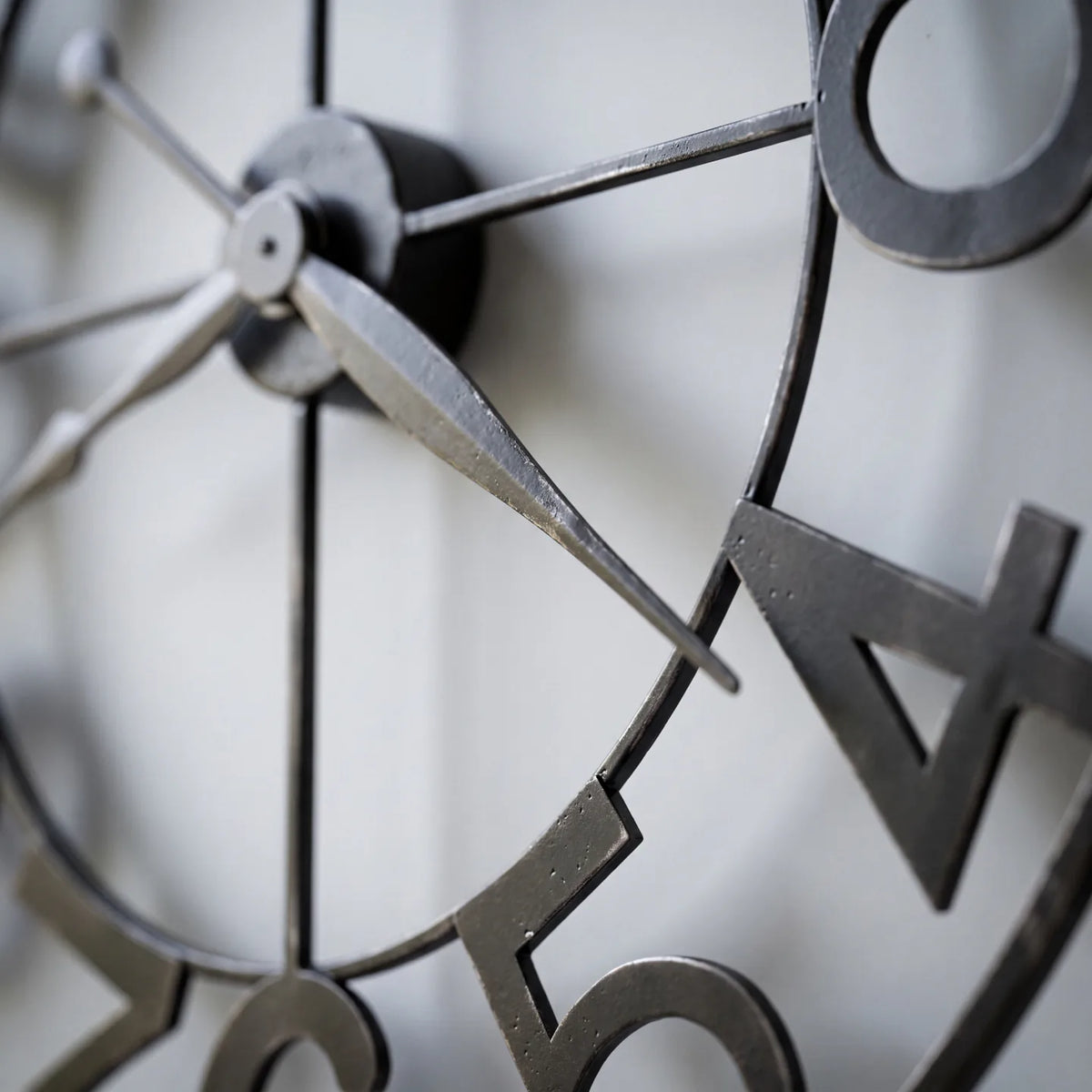 Howard Miller Felipe Wall Clock, macro close-up of the hands and dial
