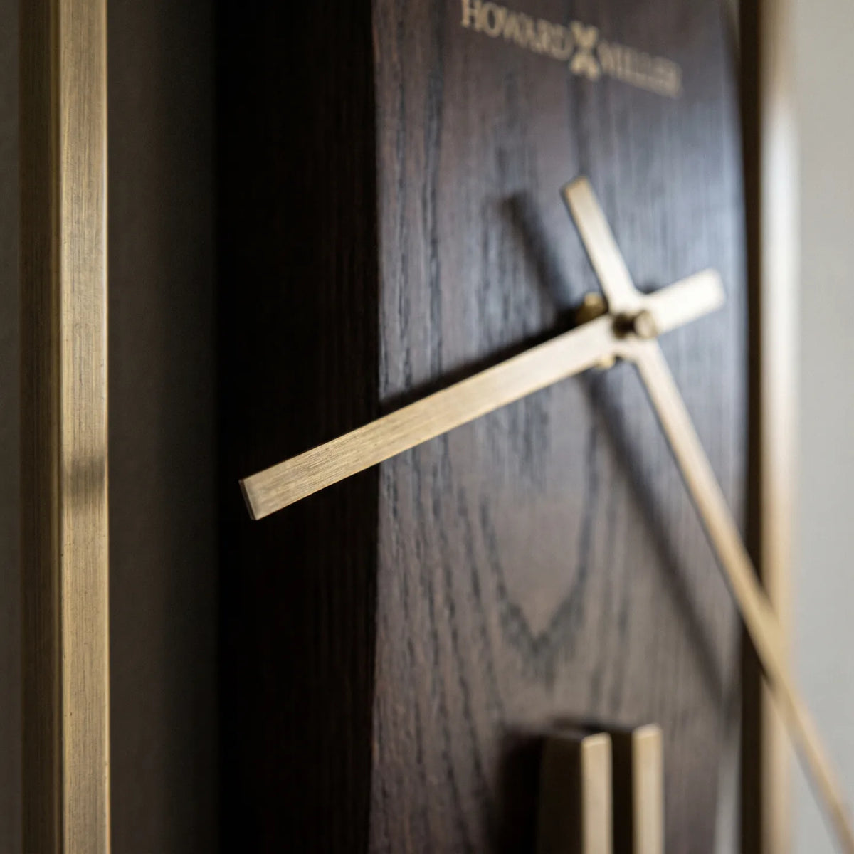 Howard Miller Harwood II Wall Clock, macro close-up of the hands and dial