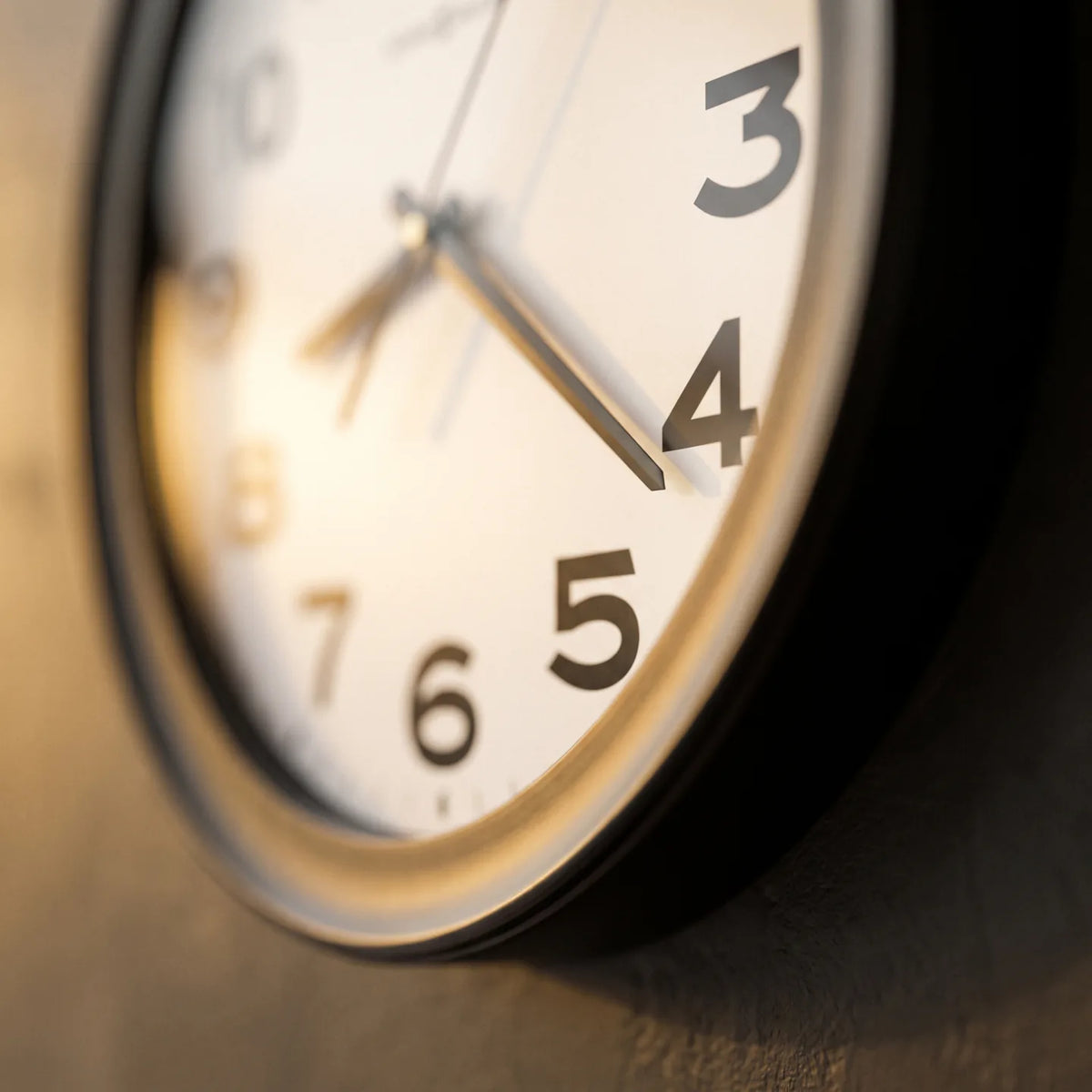Howard Miller Kenwick Wall Clock, macro close-up of the hands and dial