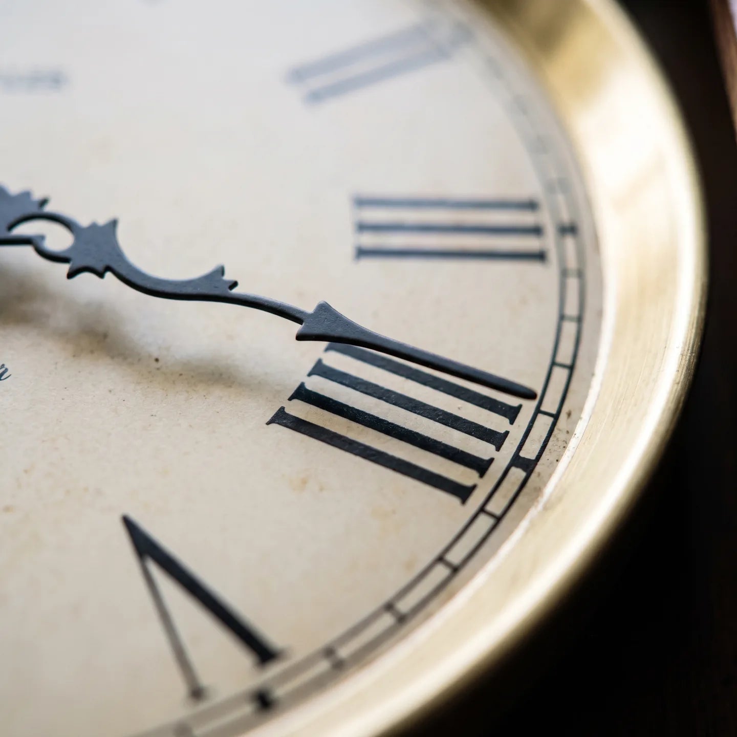Howard Miller Lewisburg Wall Clock, macro close-up of the hands and dial