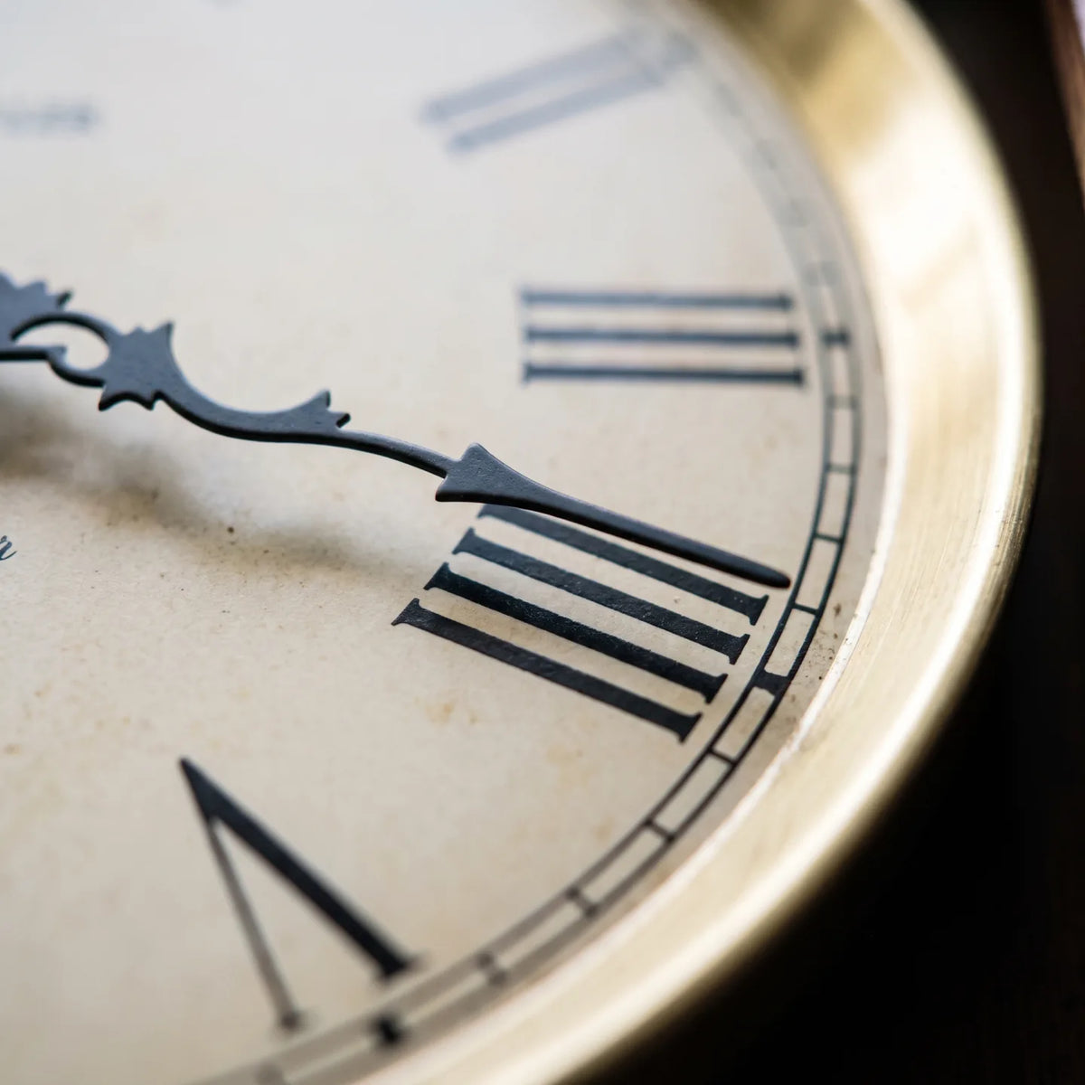 Howard Miller Lewisburg Wall Clock, macro close-up of the hands and dial