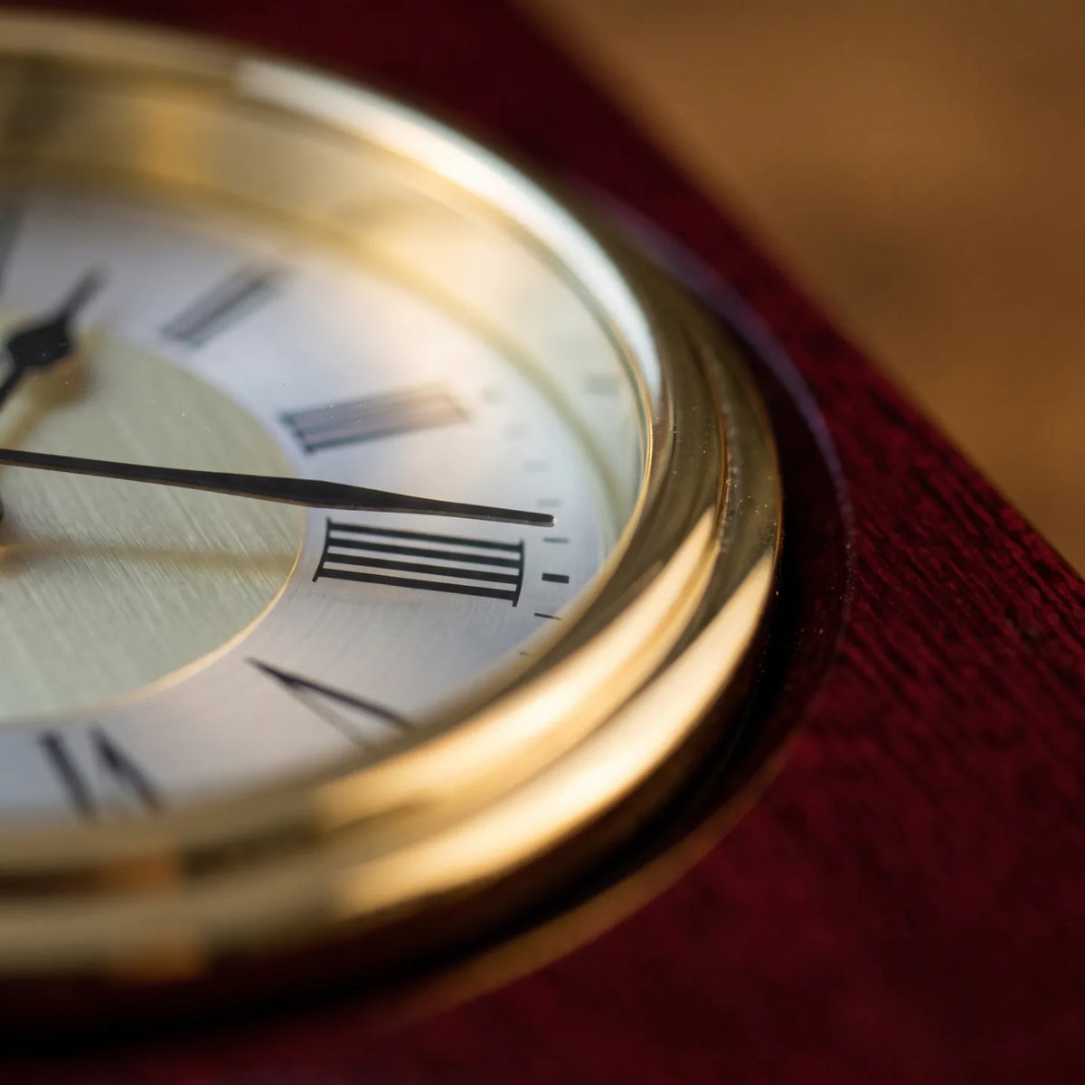 Howard Miller Portrait Book Tabletop Clock, macro close-up of the hands and dial