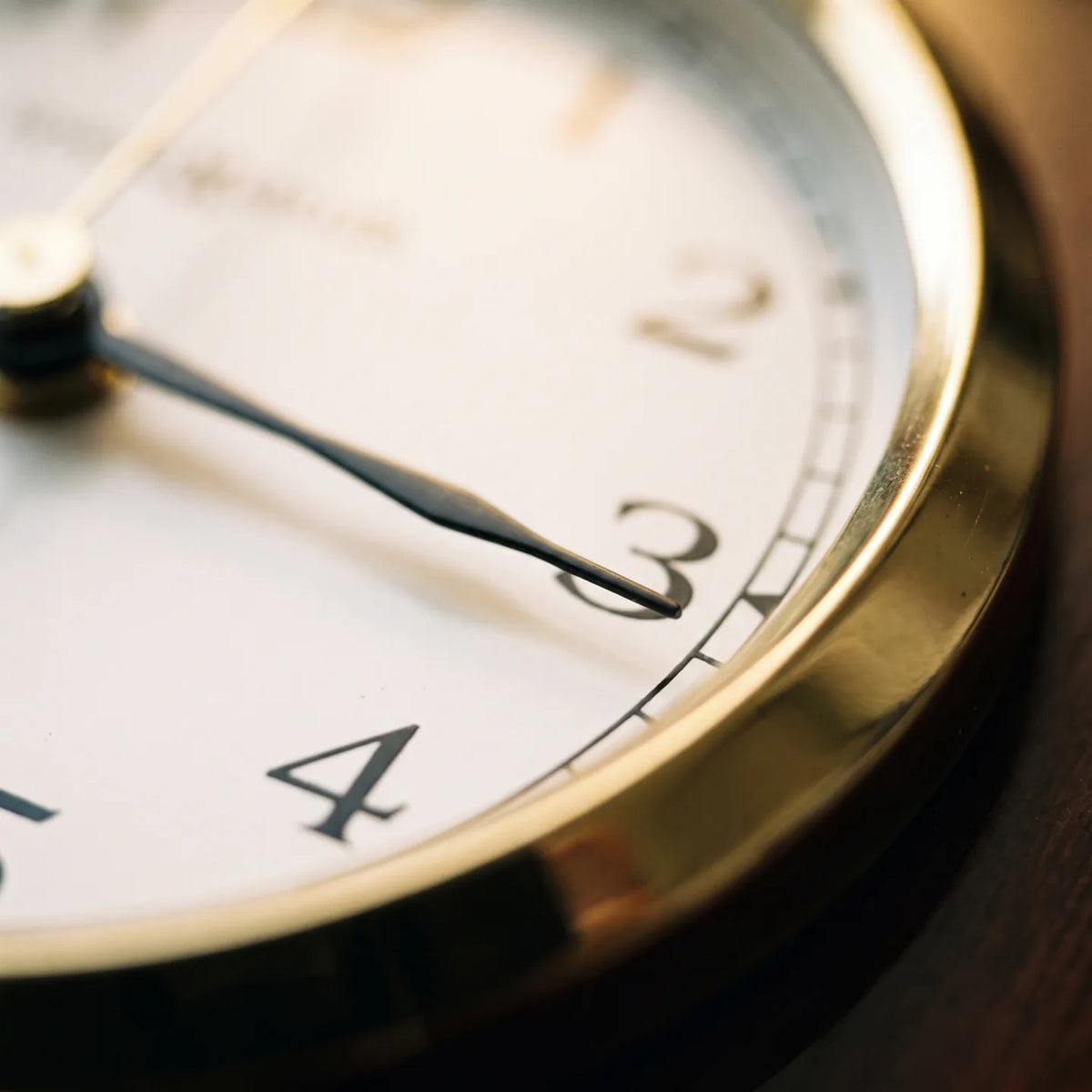 Howard Miller Shore Station Wall Clock, macro close-up of the hands and dial