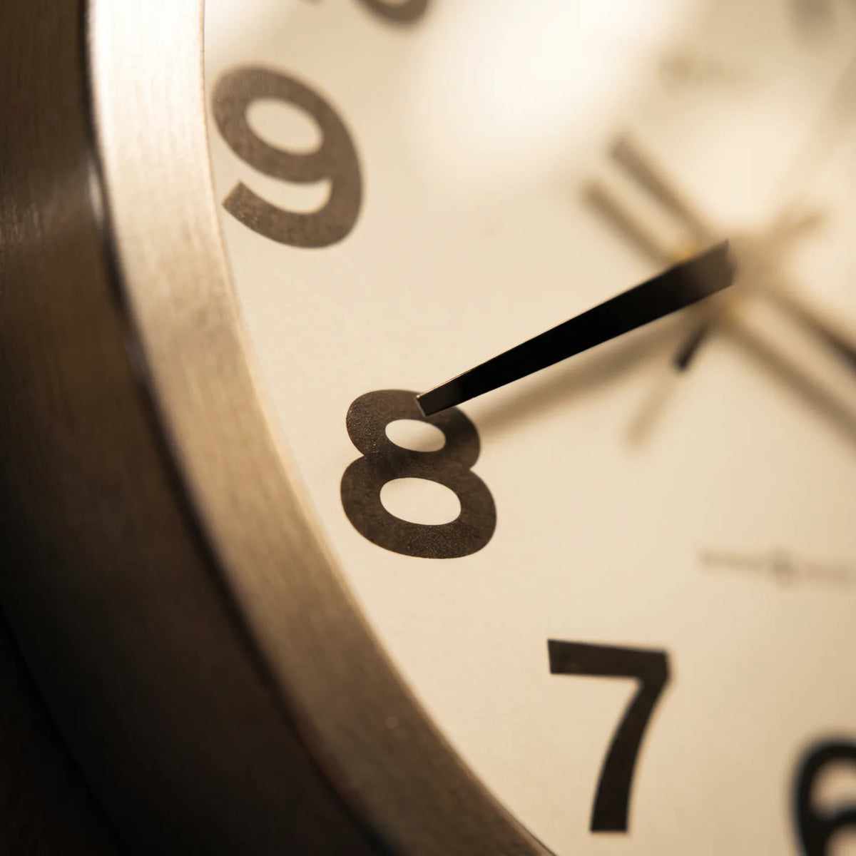 Howard Miller Spokane Wall Clock, macro close-up of the hands and dial