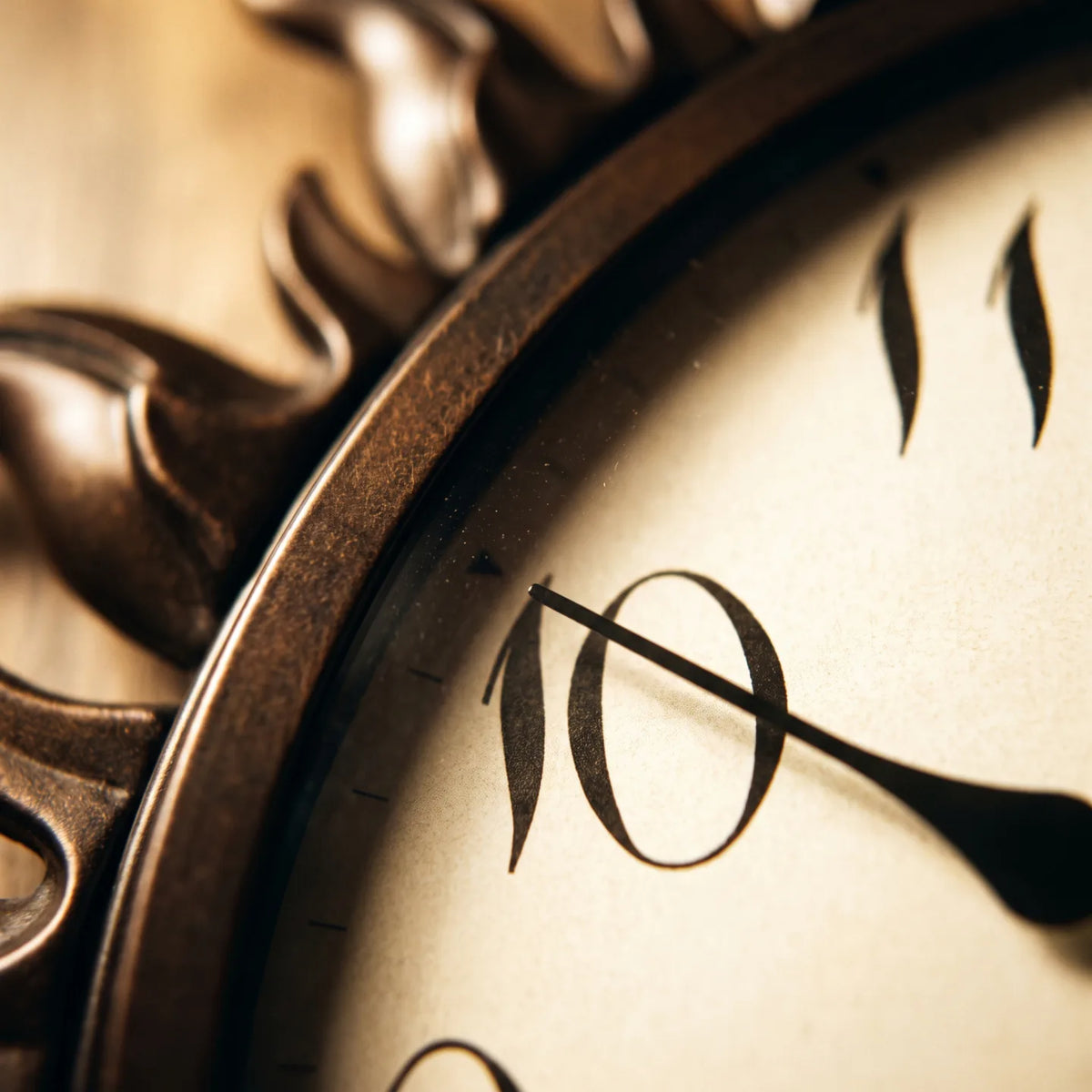 Howard Miller Sunburst II Indoor-Outdoor Wall Clock, macro close-up of the hands and dial