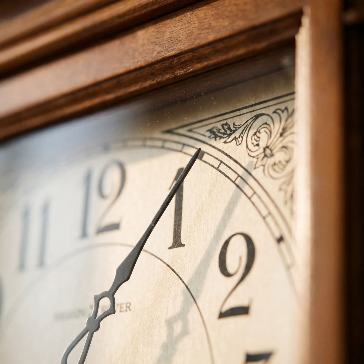Howard Miller Westbrook Wall Clock, macro close-up of the hands and dial