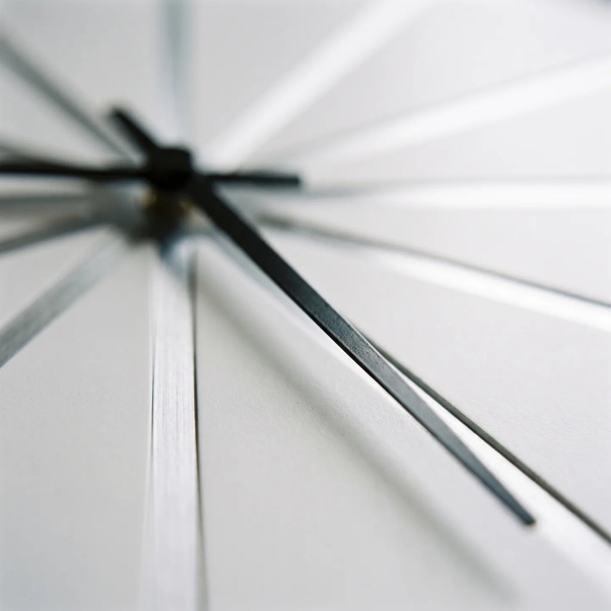 Howard Miller Zander Wall Clock, macro close-up of the hands and dial