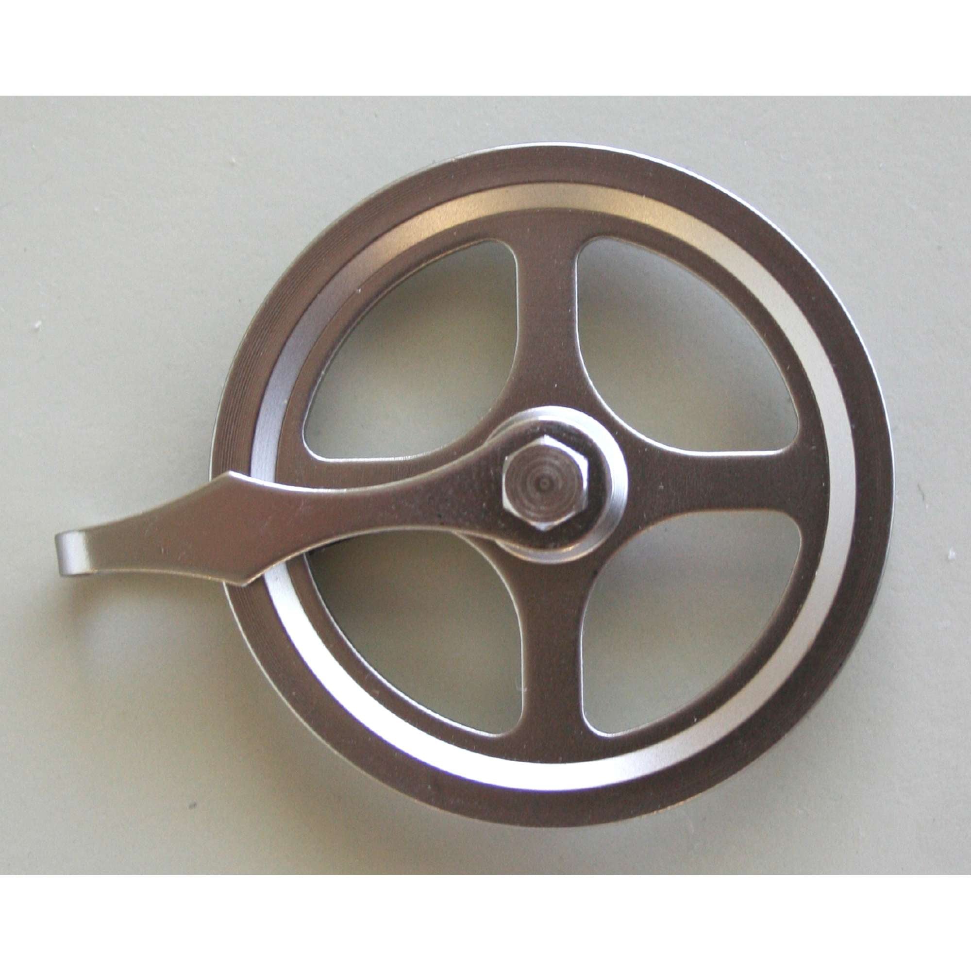 Close-up of a metallic fishing reel handle.