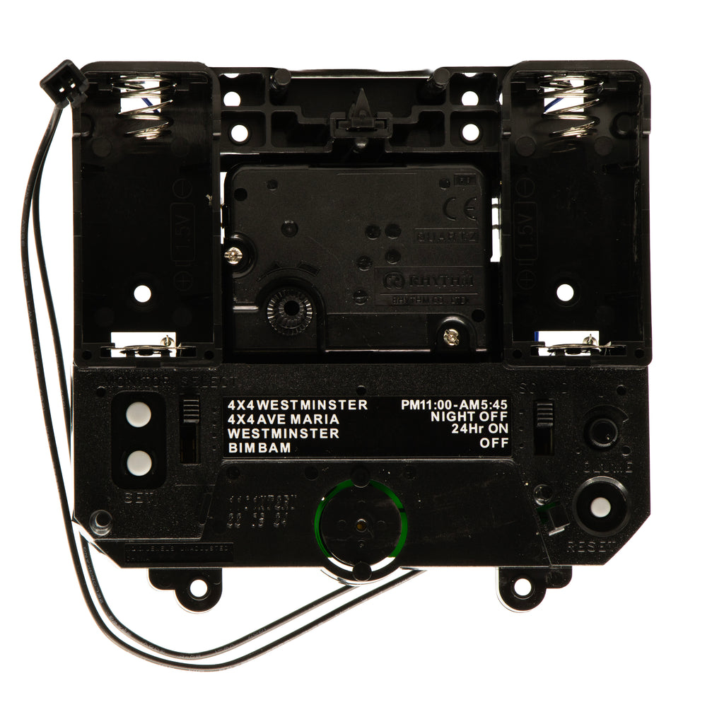 Close-up of a black electronic control unit with various labels and connectors.