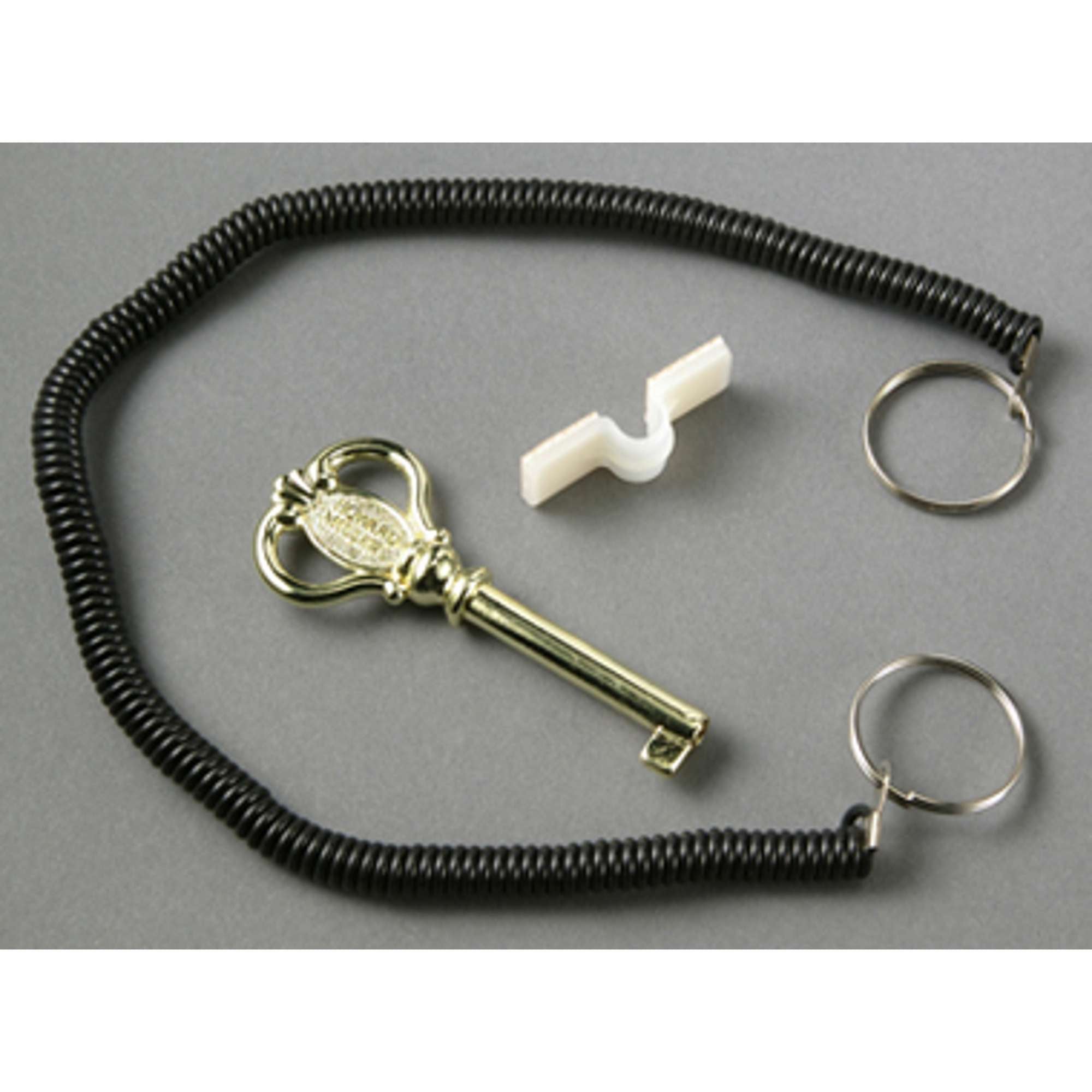 A vintage key on a coiled lanyard with two key rings and a white connector piece.