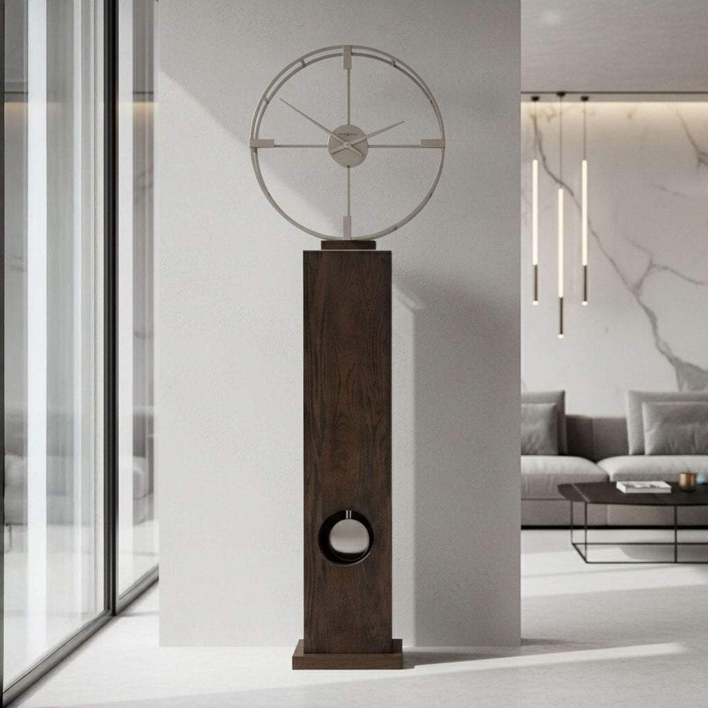 Modern decorative clock with a circular design atop a tall wooden base in a minimalist room.