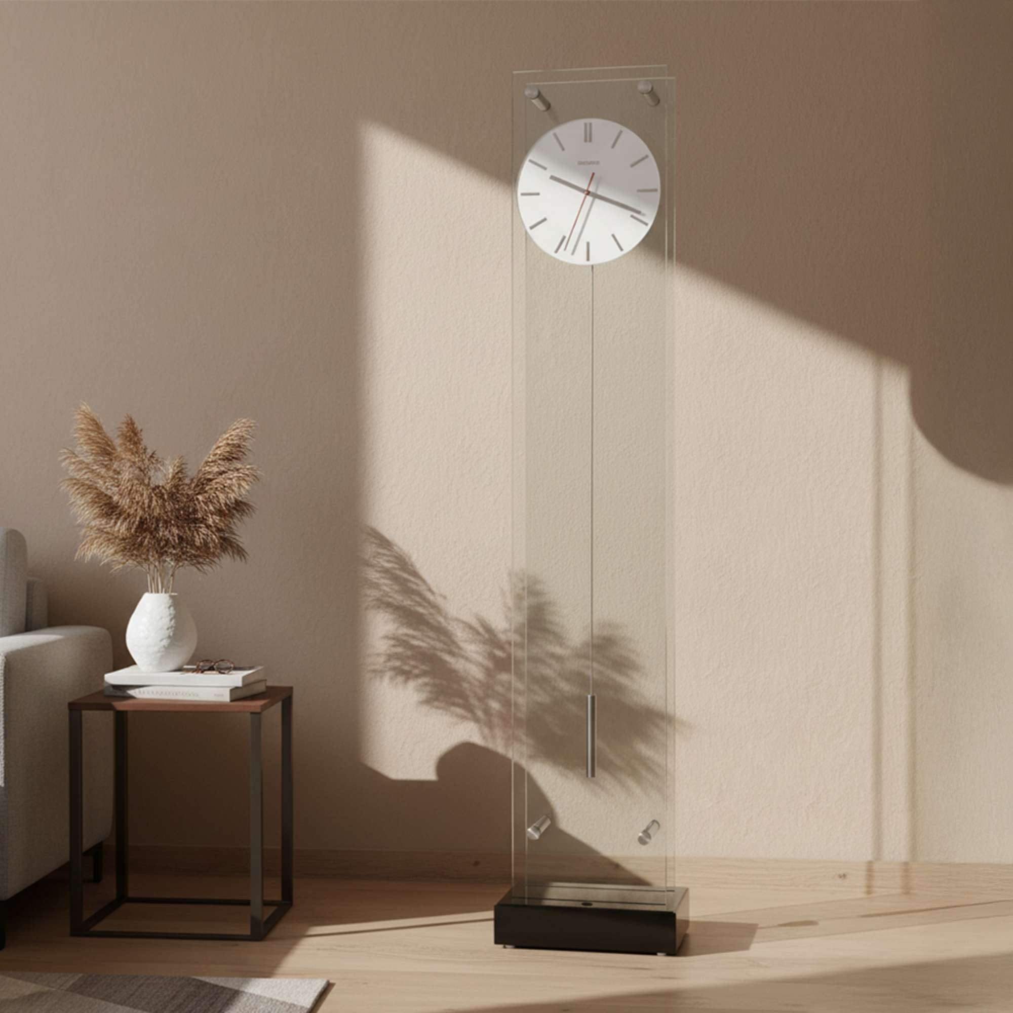 A modern wall clock mounted on a transparent column in a minimalist interior.