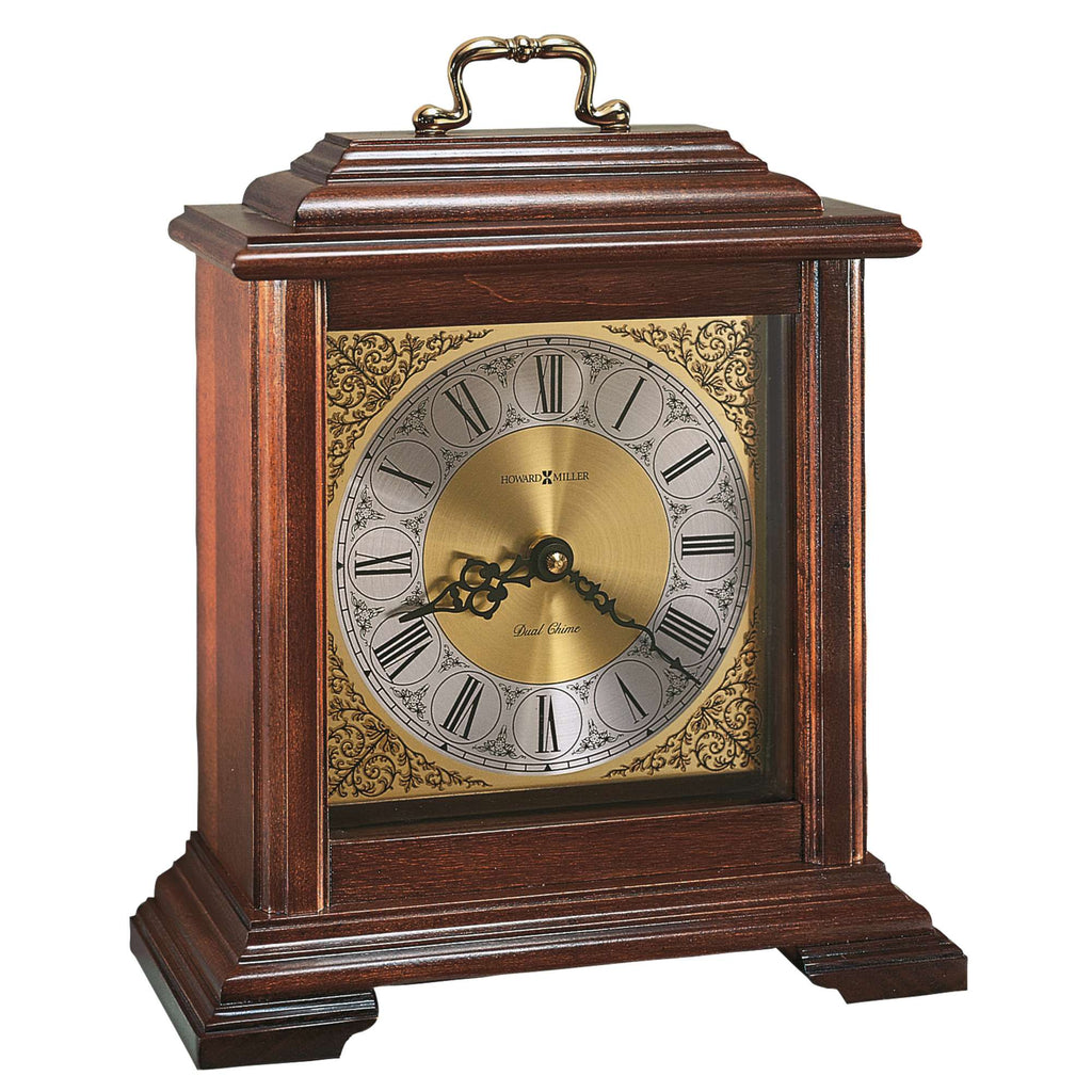 A vintage wooden mantel clock with Roman numerals and a decorative golden face.