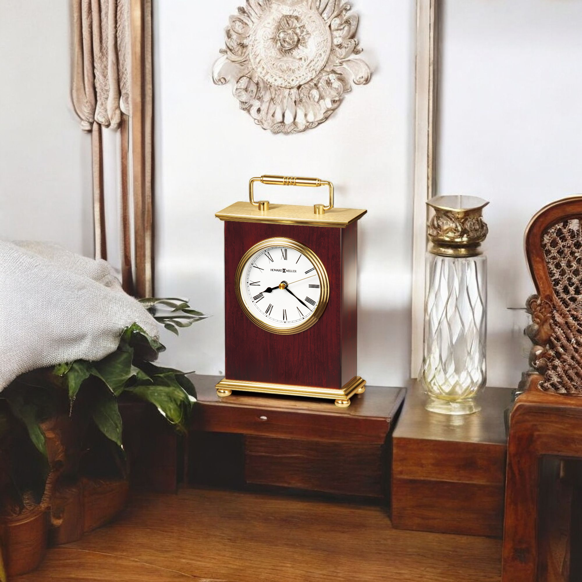 Vintage wood and gold clock on a wooden table in a cozy interior setting.