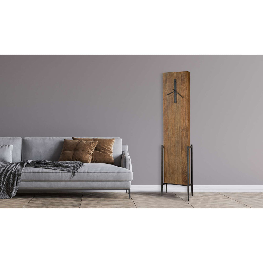 Modern living room featuring a gray sofa with decorative pillows and a wooden wall clock on a stand.