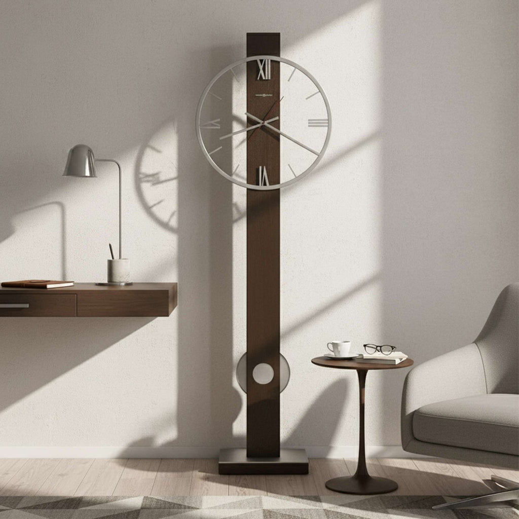 Modern minimalist wall clock on a wooden panel, casting a shadow in a well-lit room with a small table and chair.