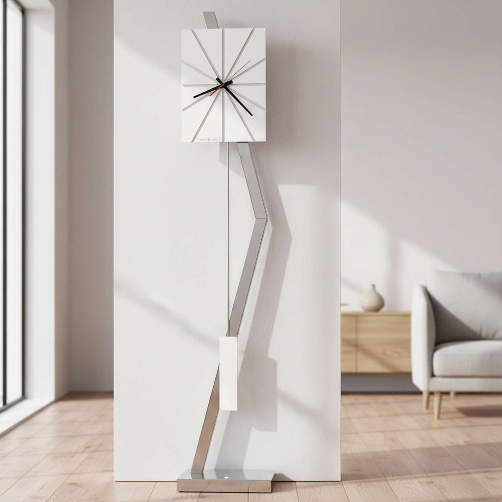 Modern wall clock with a geometric design and sleek metal stand.